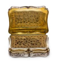 A Victorian Silver Vinaigrette, Edward Smith, Birmingham, 1843, the lid worked to depict a cathedral.
