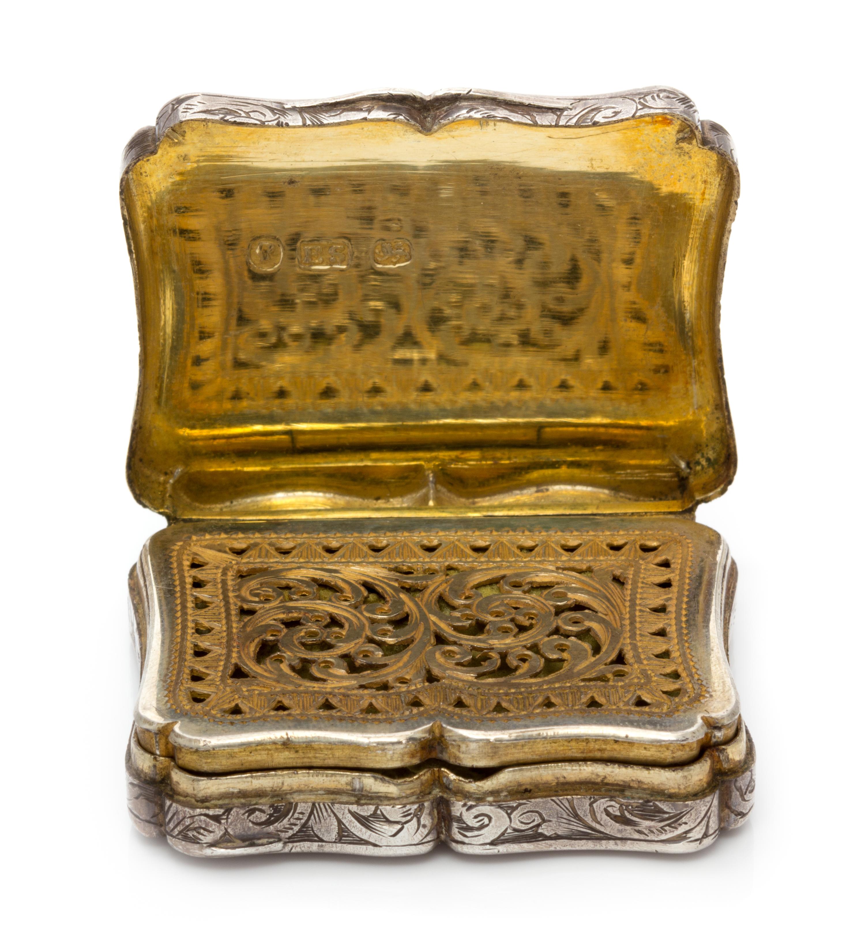A Victorian Silver Vinaigrette, Edward Smith, Birmingham, 1843, the lid worked to depict a cathedral.