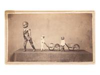 [AFRICAN AMERICANA - EARLY PHOTOGRAPHY]. CDV of a trio of toys displayed on a tabletop.