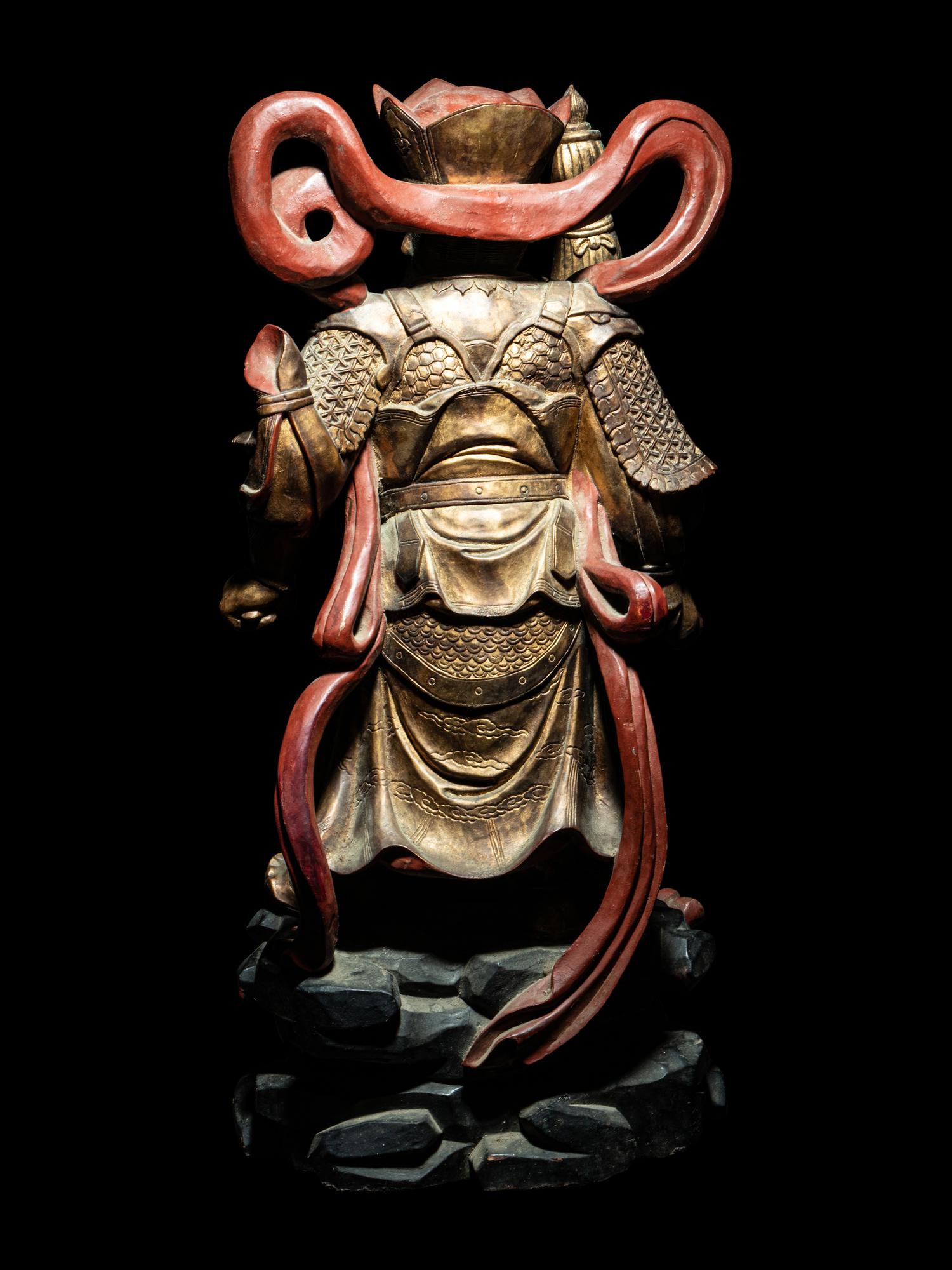 A Set of Four Gilt and Red Lacquered Wood Figures of Guardians