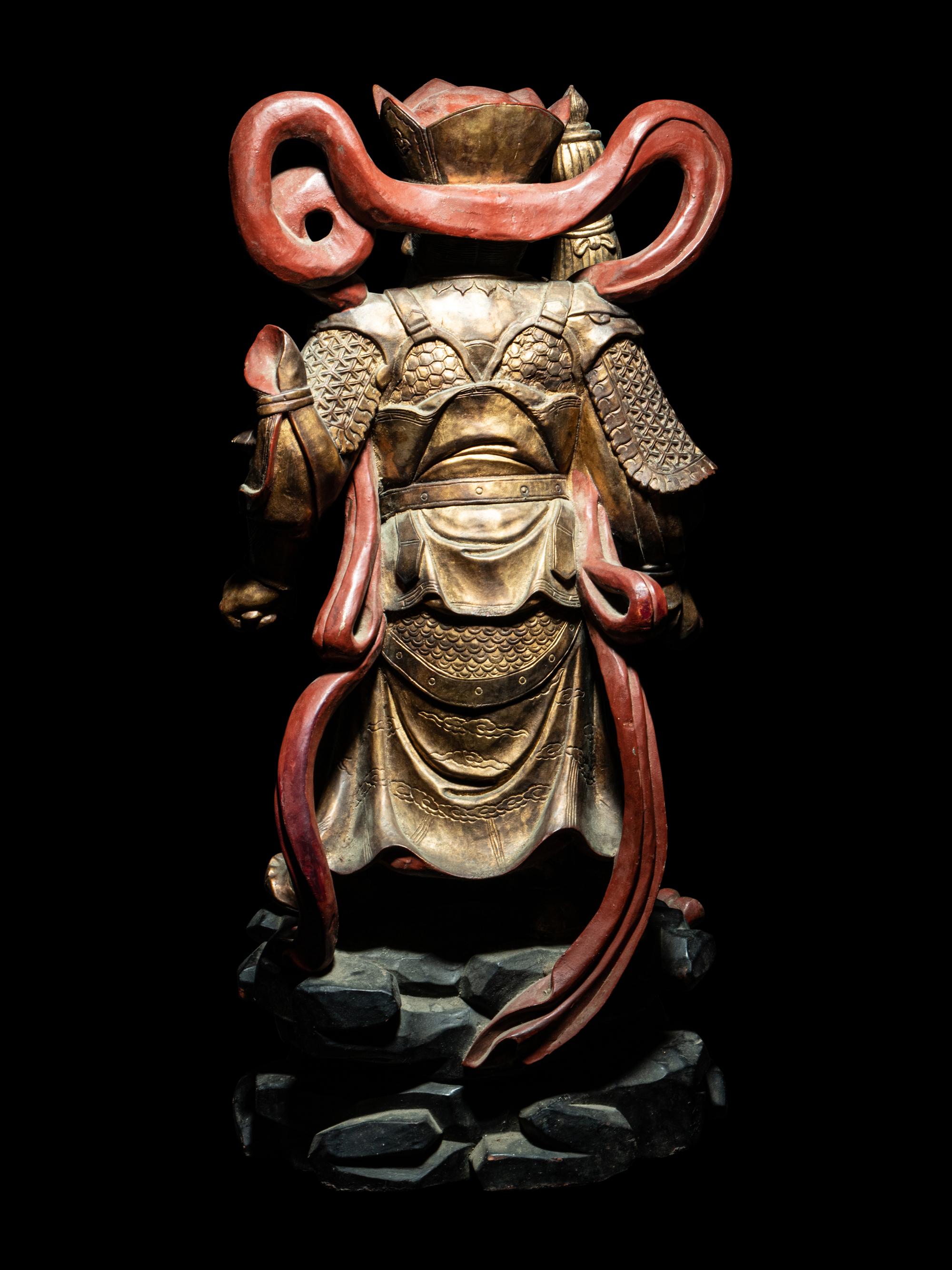A Set of Four Gilt and Red Lacquered Wood Figures of Guardians