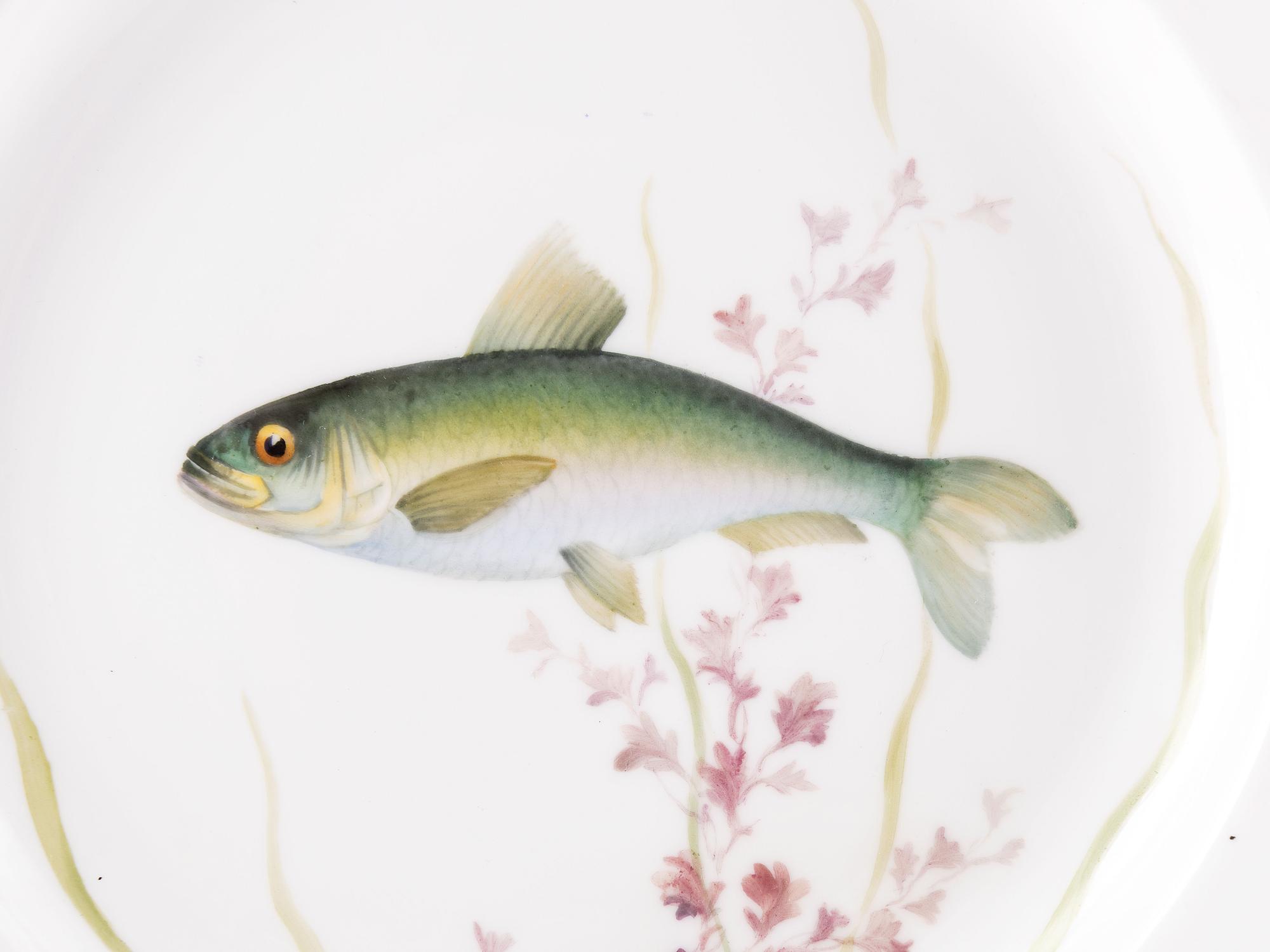 A Set of Twelve Royal Copenhagen Parcel Gilt Porcelain Fish Plates