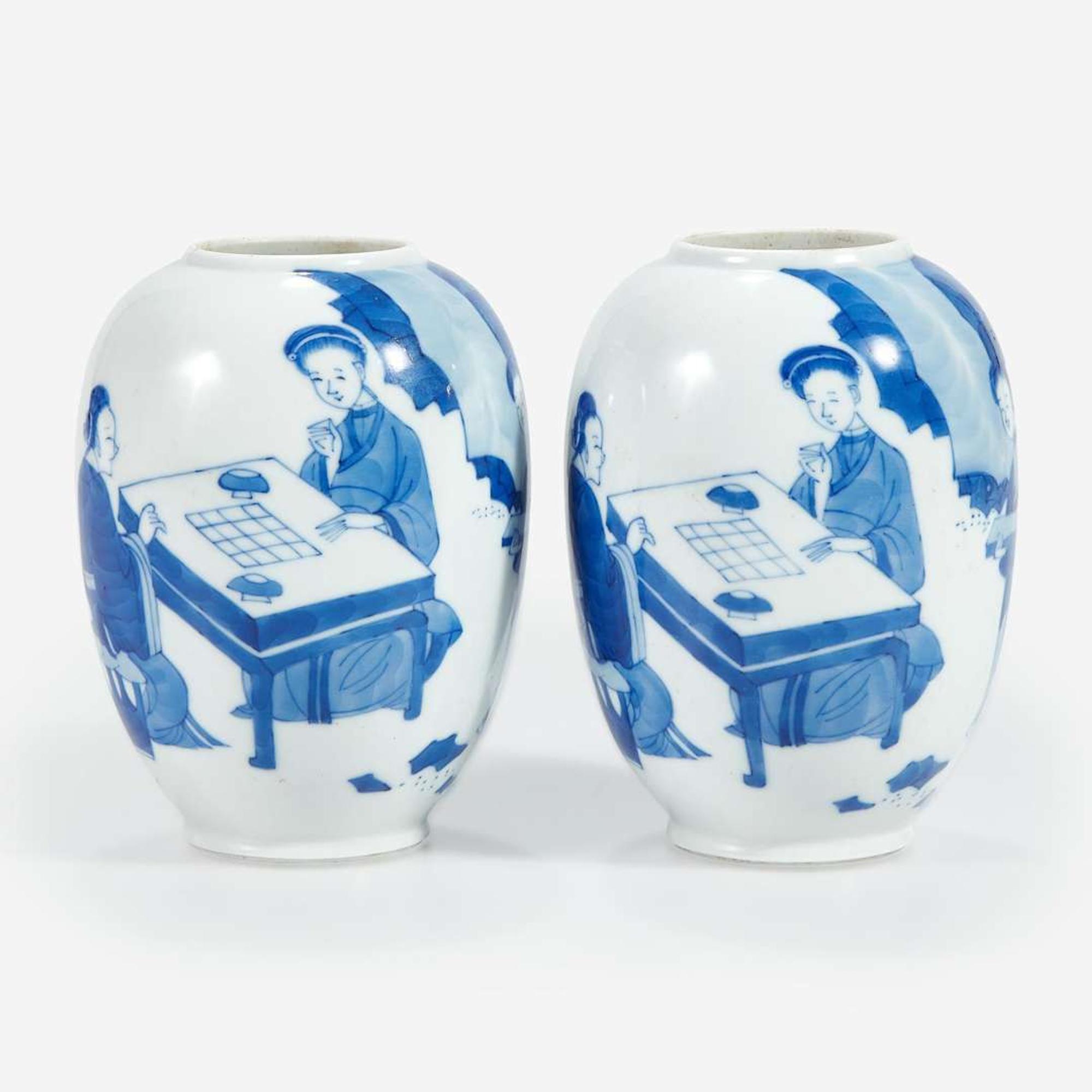 A pair of Chinese blue and white-decorated porcelain small ovoid vases