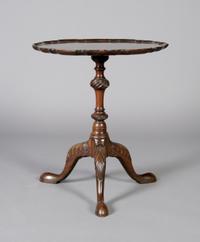 A George III Style Mahogany Side Table, Height 22 x diameter 19 5/8 inches.
