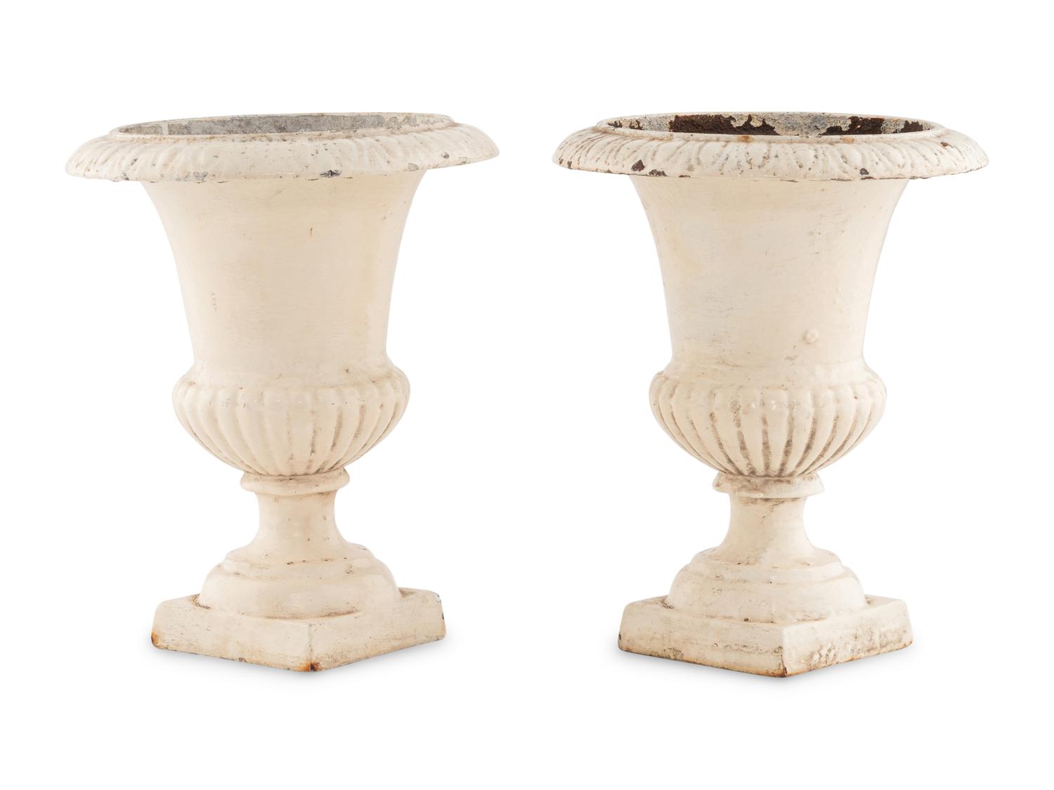 A Pair of Painted Iron Urns