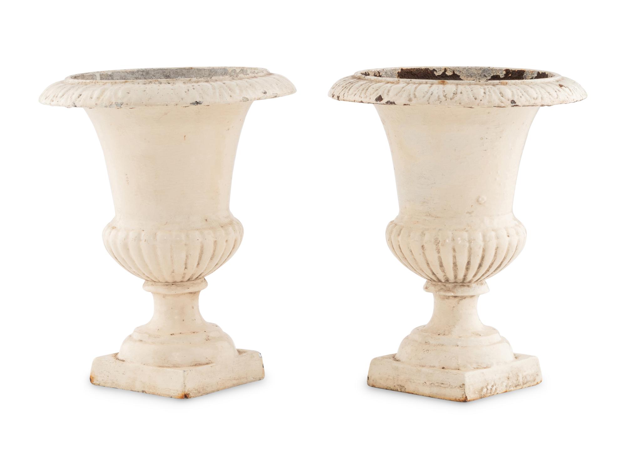 A Pair of Painted Iron Urns