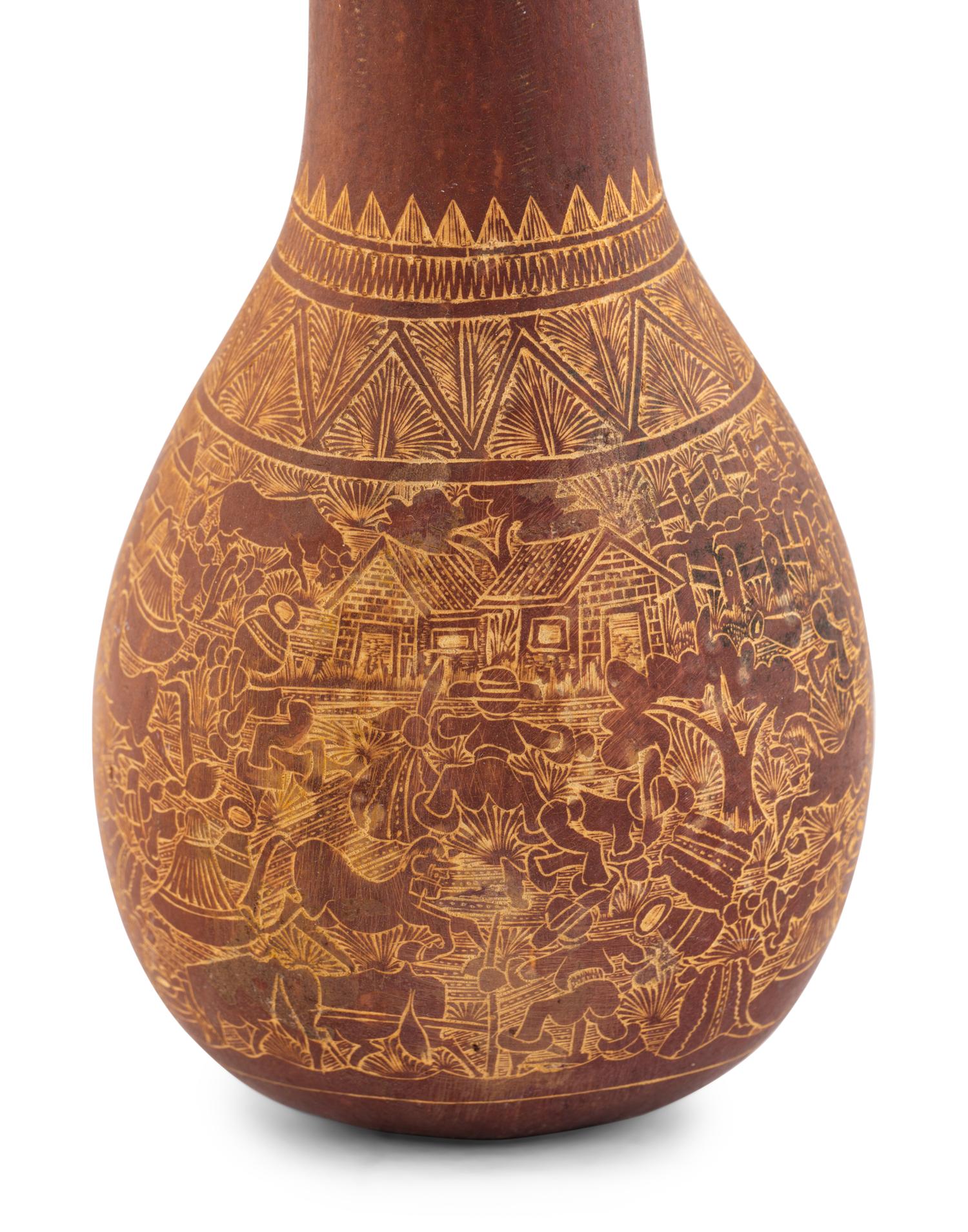 A Carved Gourd Rattle
