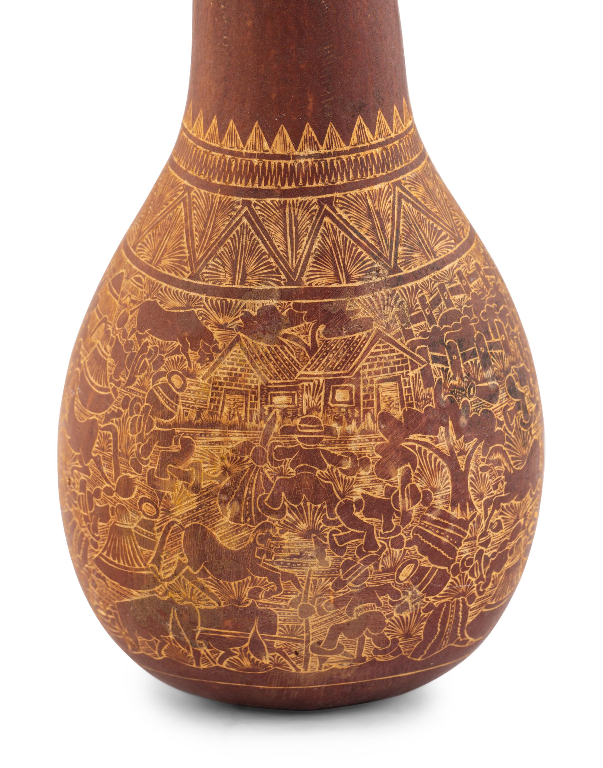 A Carved Gourd Rattle