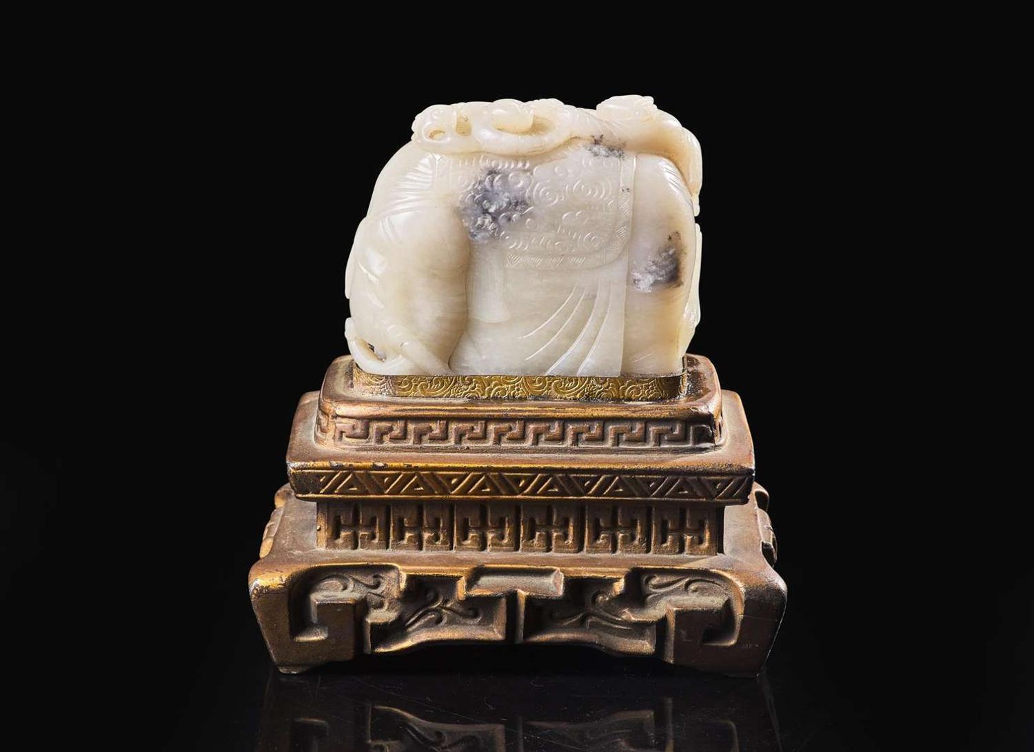 A Chinese carved white and grey jade "Elephant and Boys" group 太童子洗象玉雕