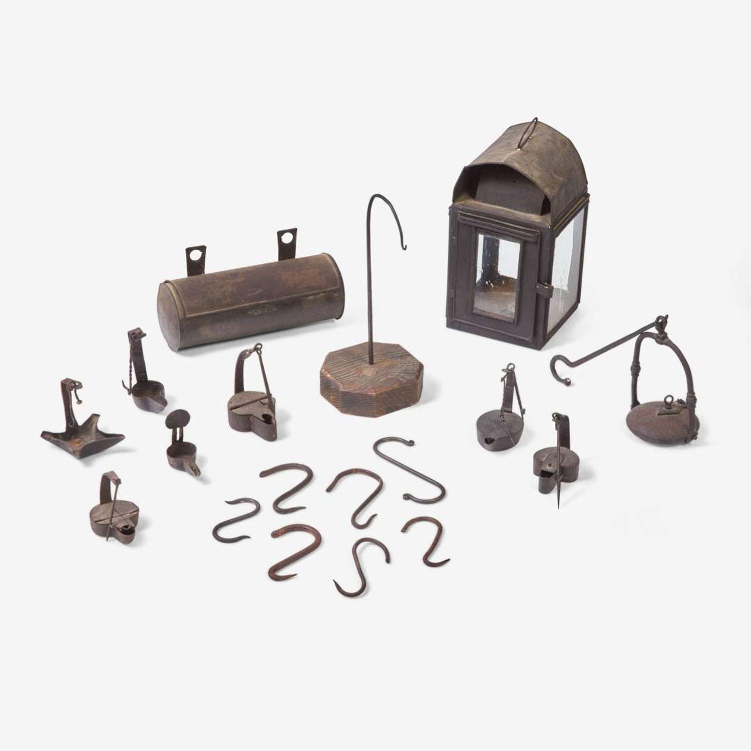 A group of ten wrought iron and tinware lighting devices 18th / 19th century