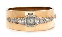 A 14 Karat Rose Gold, Platinum and Diamond Bangle Bracelet, 33.60 dwts.