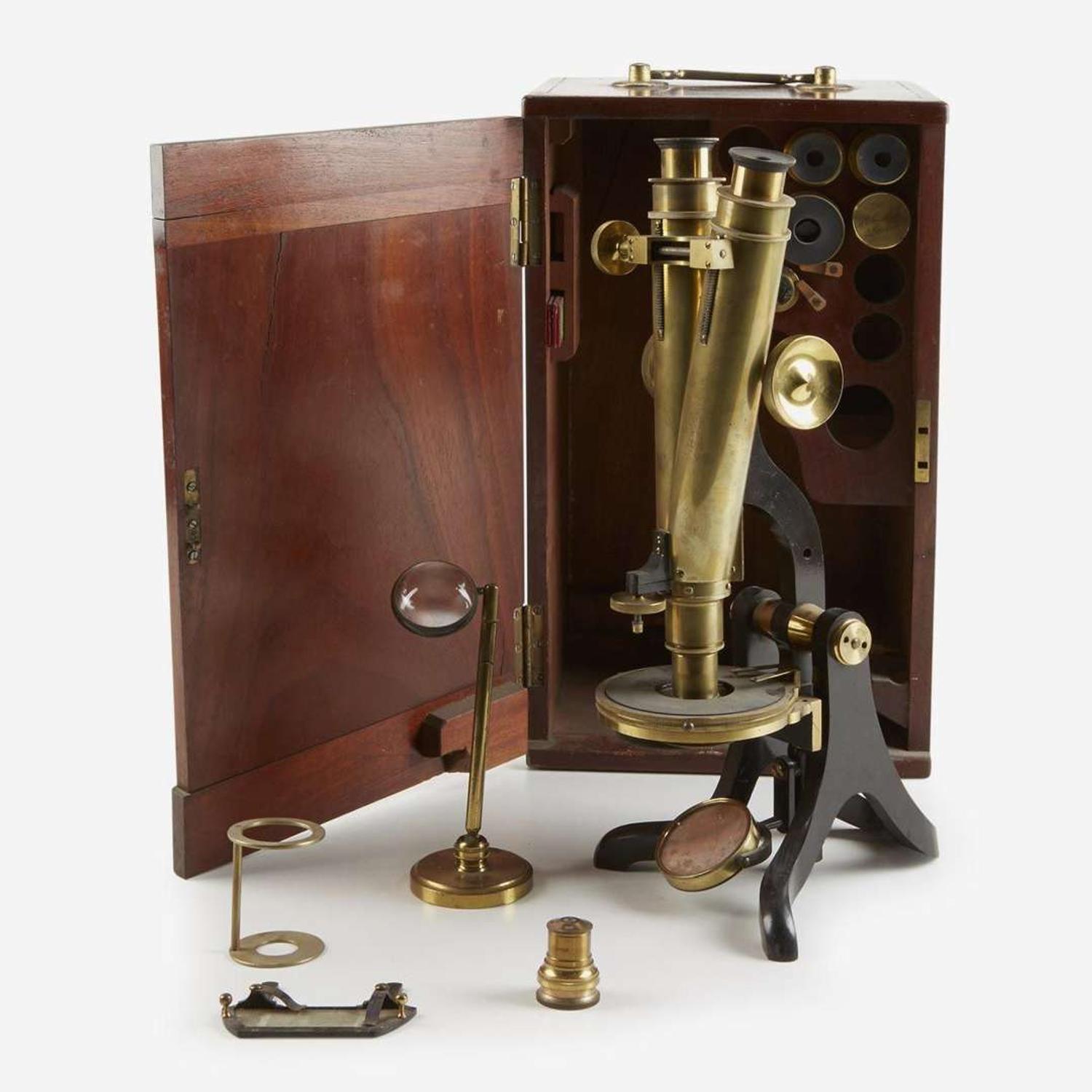 A brass binocular microscope with mahogany traveling chest Henry Crouch, London, retailed by J. W. Queen & Co., Philadelphia, PA, circa 1870s