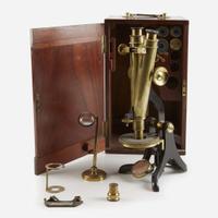 A brass binocular microscope with mahogany traveling chest Henry Crouch, London, retailed by J. W. Queen & Co., Philadelphia, PA, circa 1870s