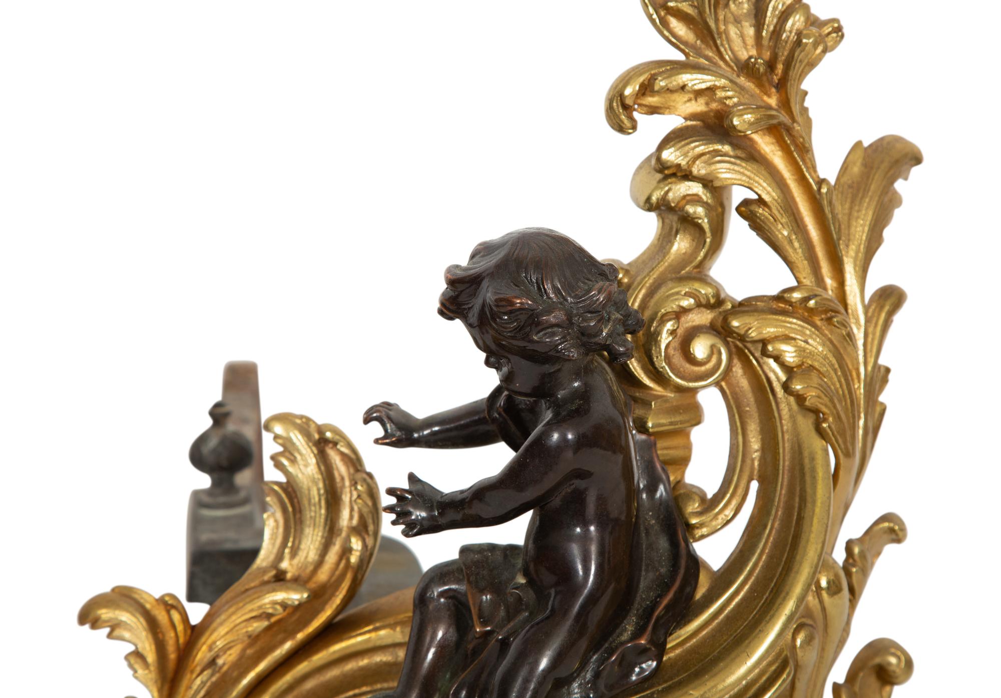 A Pair of Louis XV Style Gilt and Patinated Bronze Chenets