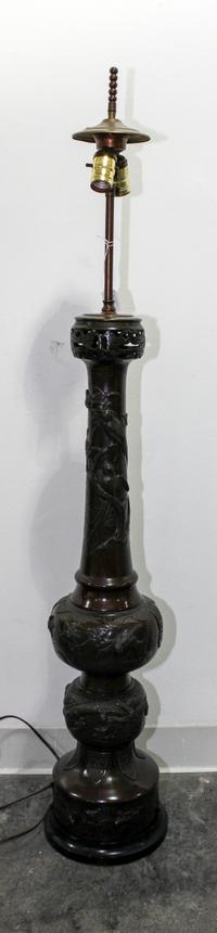 A Japanese Bronze Lamp with an Associated American Leaded Glass Shade Height overall 47 1/2 inches.