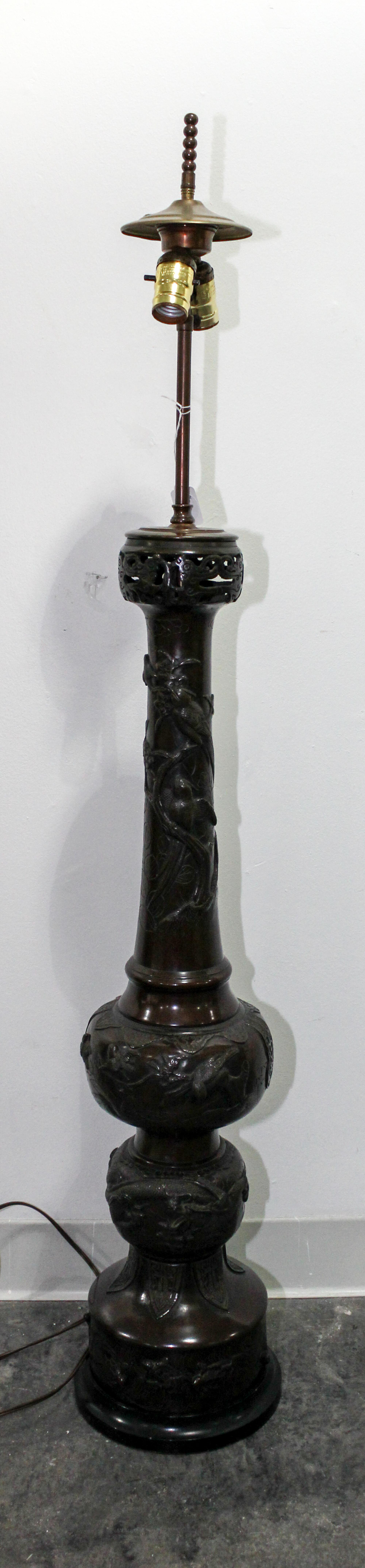 A Japanese Bronze Lamp with an Associated American Leaded Glass Shade Height overall 47 1/2 inches.