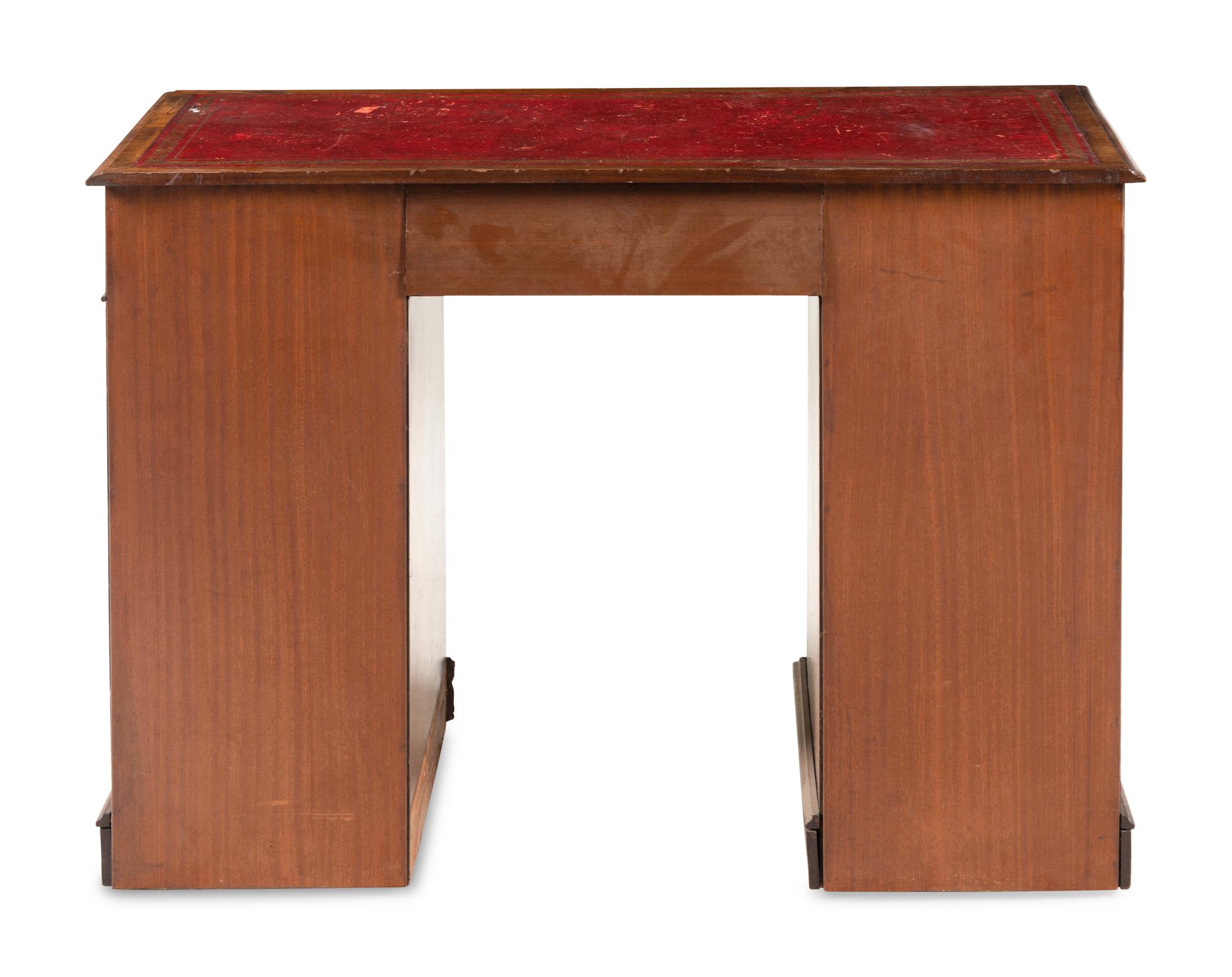 An Edwardian Walnut Pedestal Desk