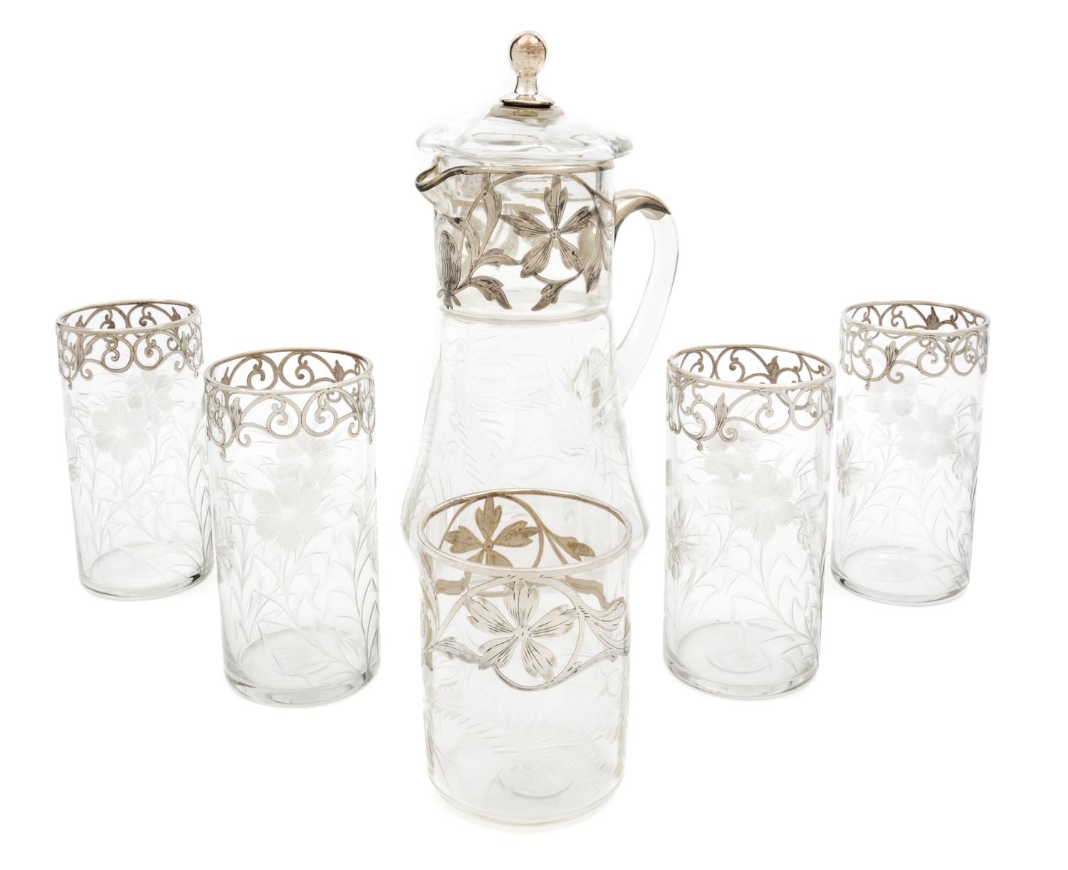 An Assembled Silver Overlay Engraved Glass Drinking Set Height of pitcher 9 3/8 inches.