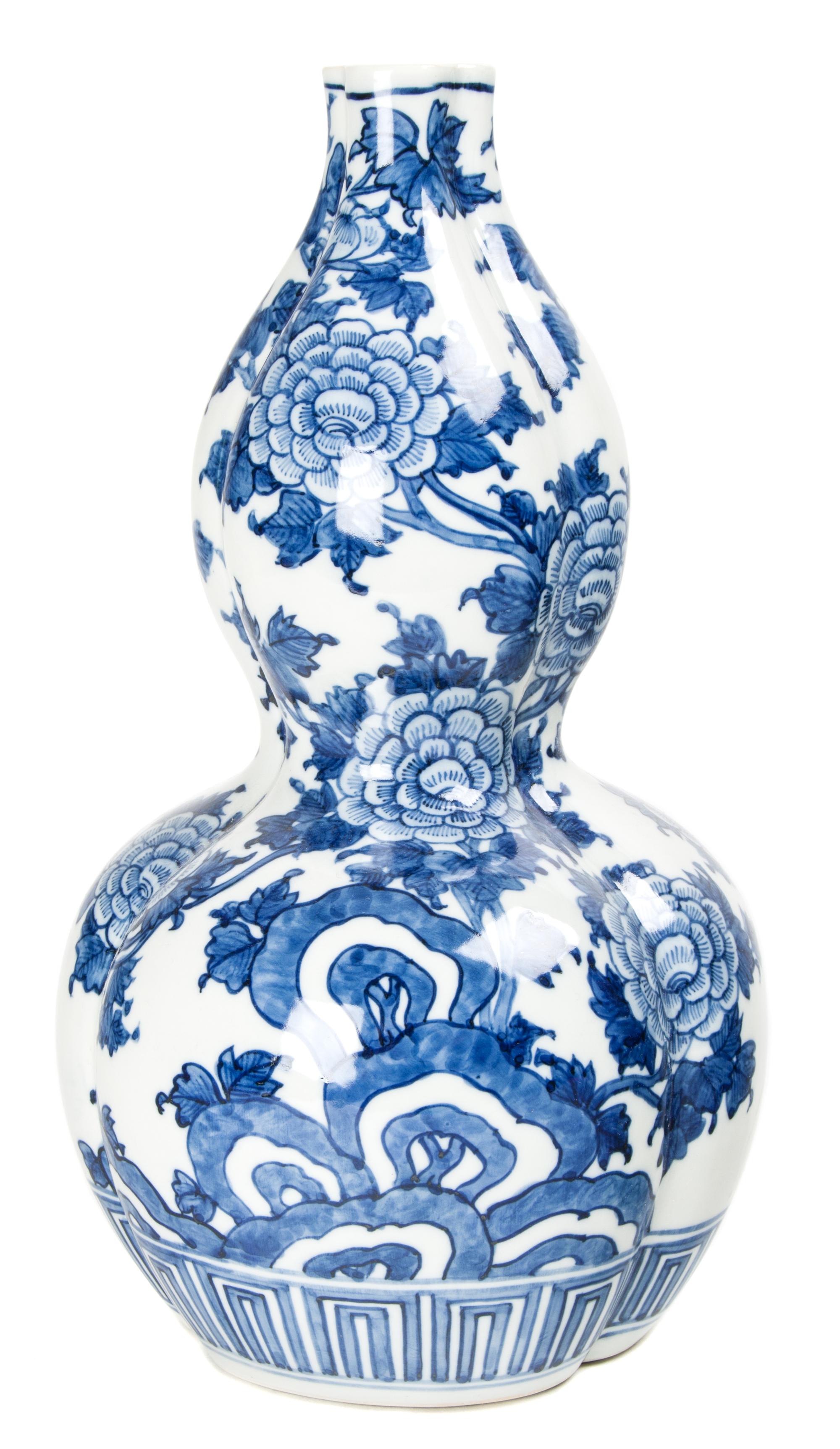 A Japanese Blue and White Porcelain Vase Height 15 inches.