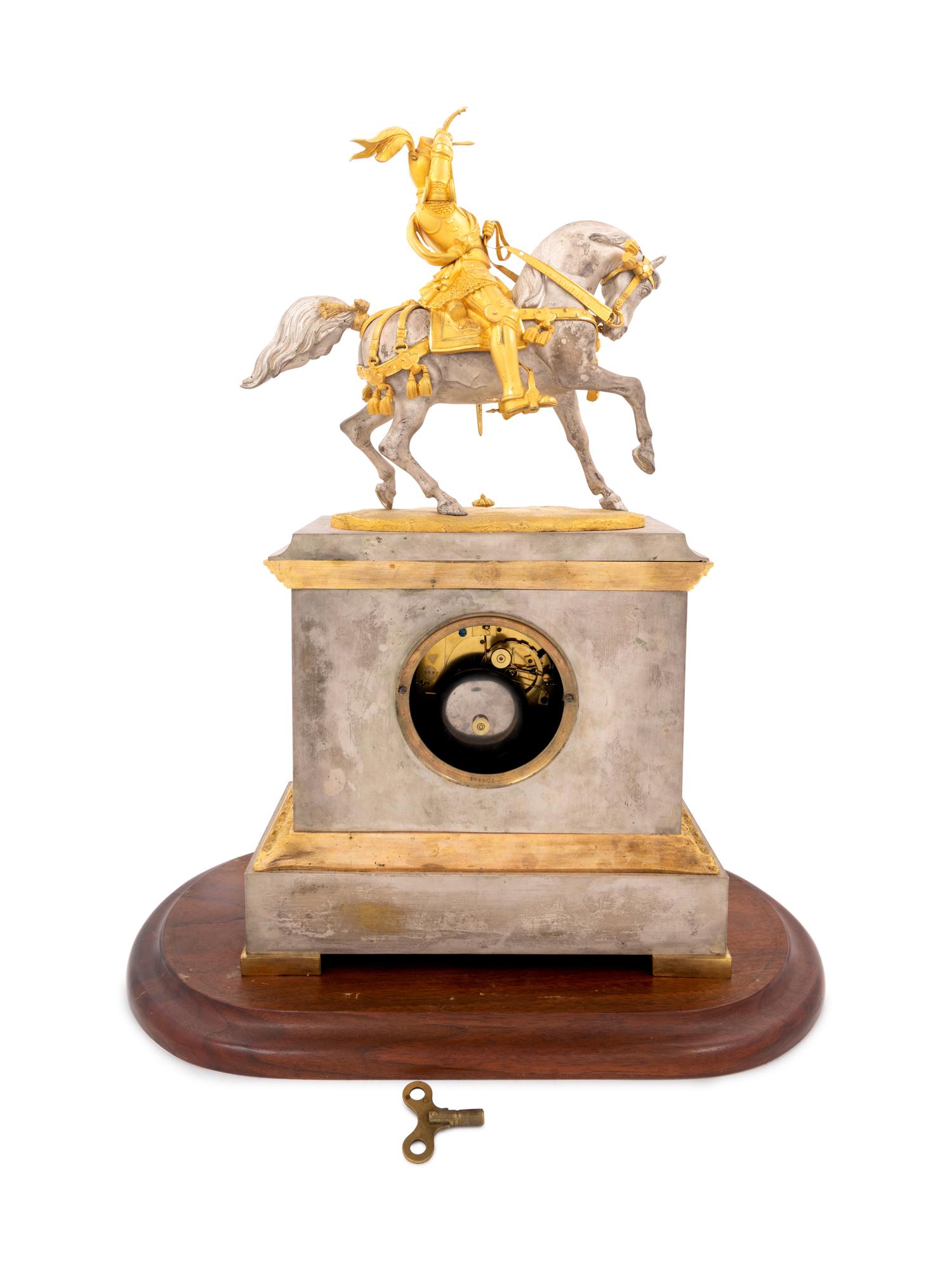 A French Gilt Bronze and Silvered Metal Figural Mantel Clock