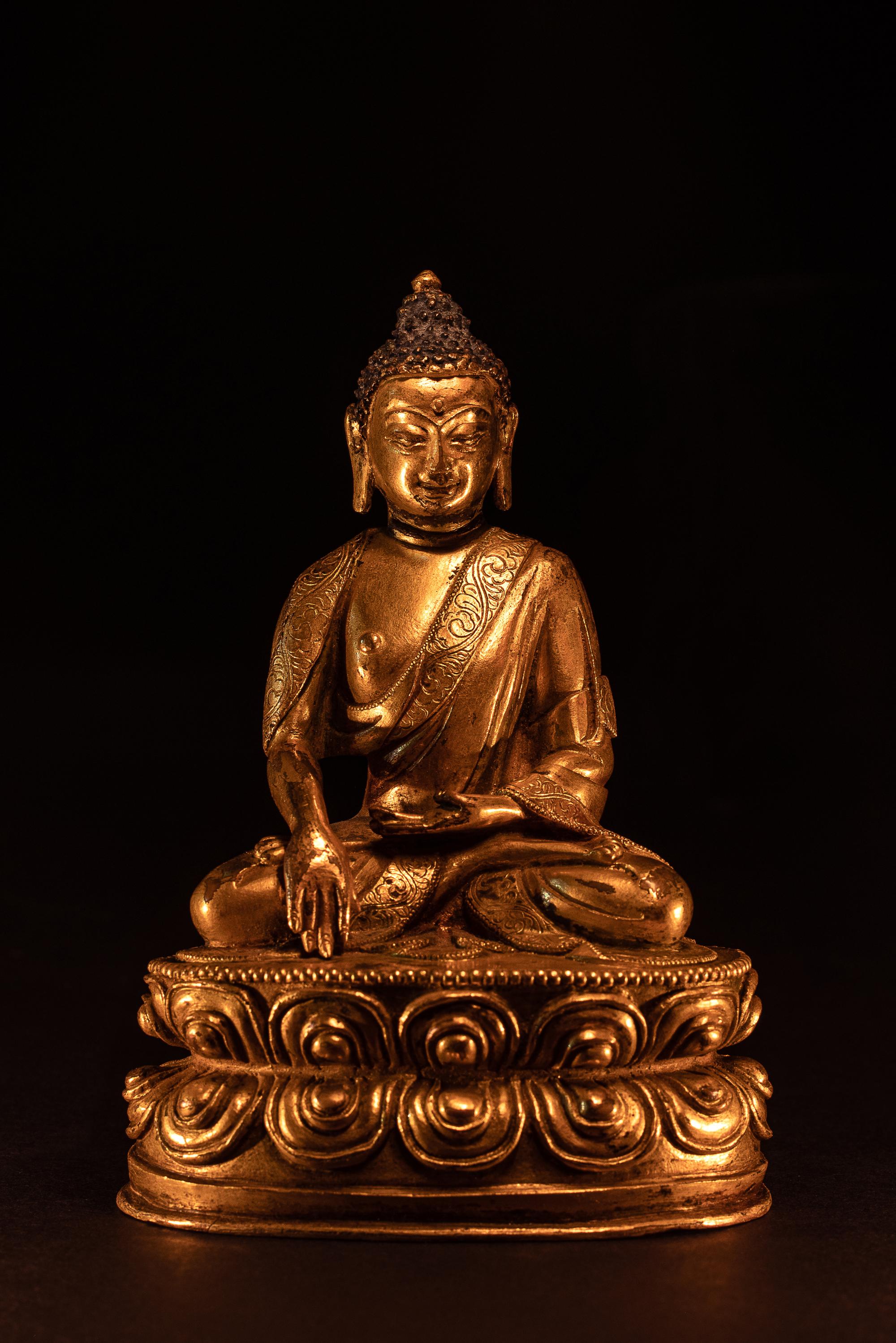 A Small Sino-Tibetan Gilt Bronze Figure of Seated Buddha Shakyamuni