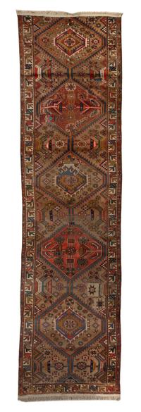 A Persian Wool Runner, 11 feet x 2 feet 10 inches.