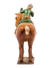 A Chinese Sancai Glazed Burial Figure of a Mounted Attendant