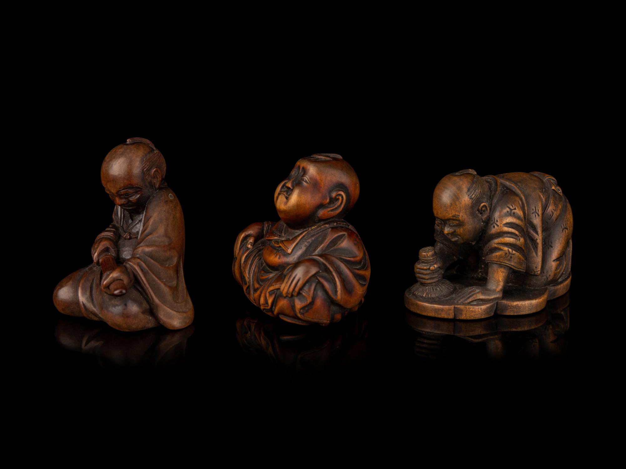 Three Japanese Carved Boxwood Figural-Form Netsuke