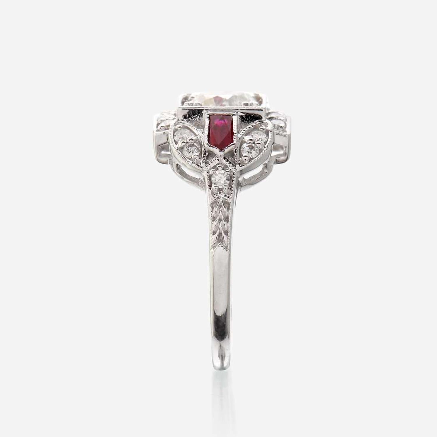 A diamond, ruby, and eighteen karat white gold ring
