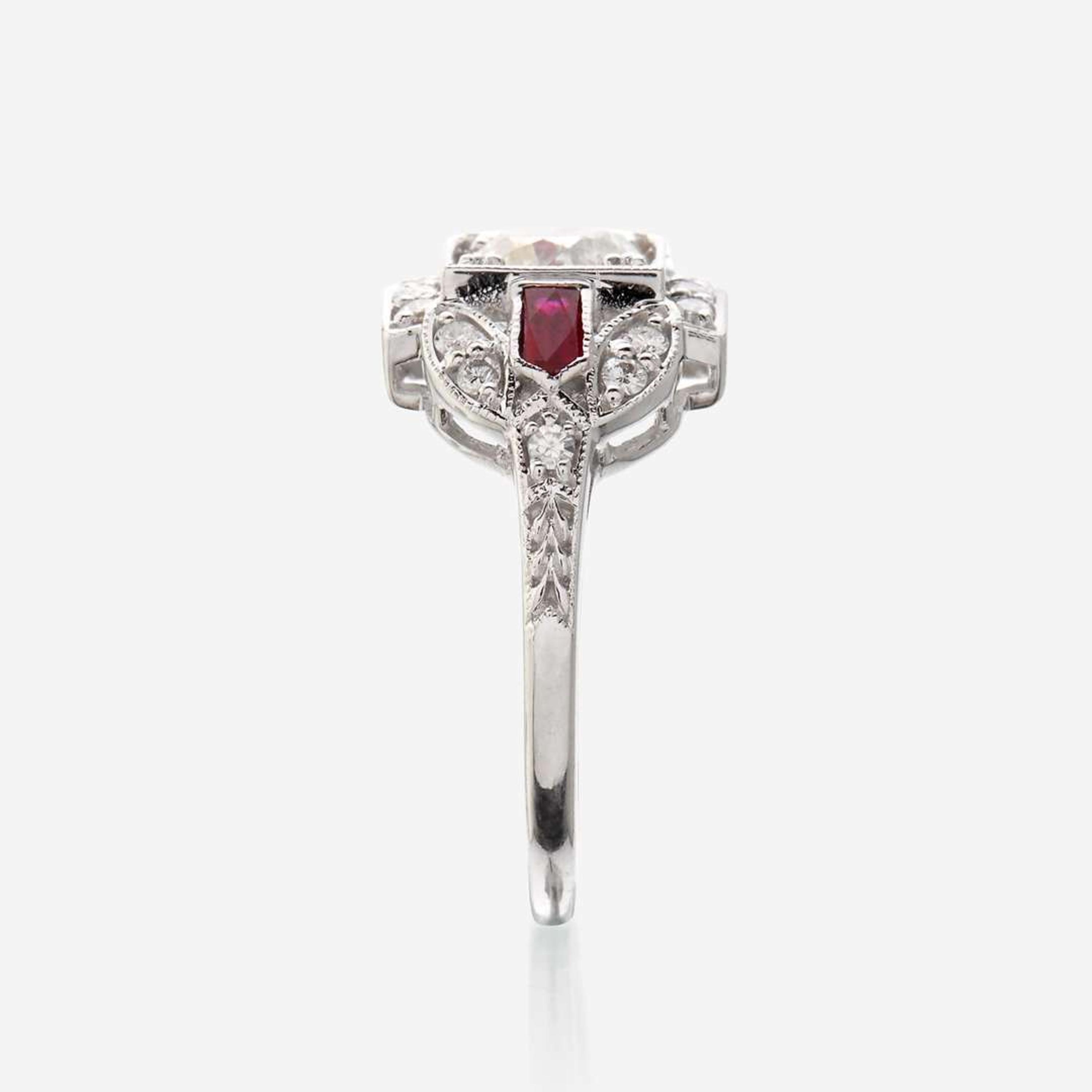 A diamond, ruby, and eighteen karat white gold ring