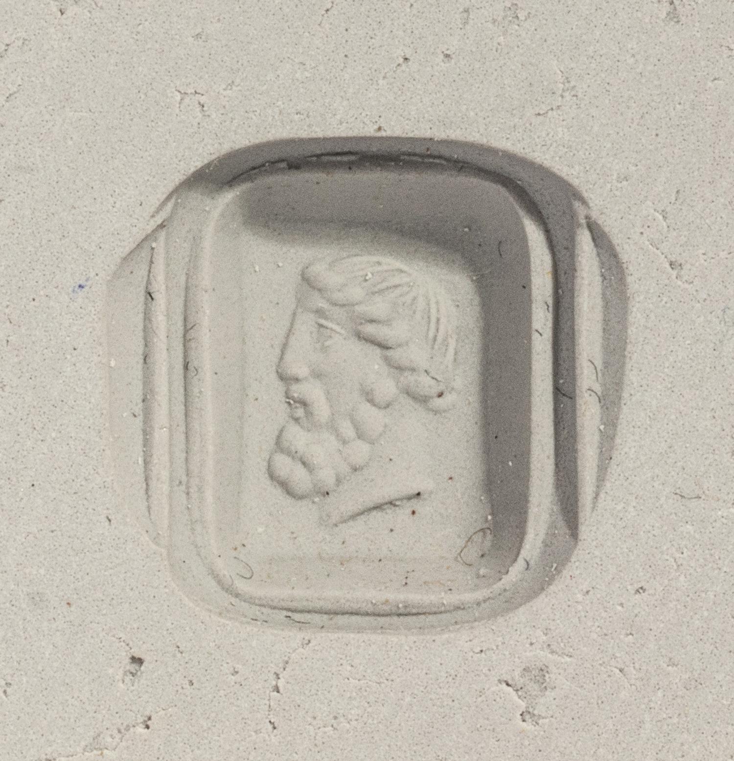 A Neoclassical Gold and Nicolo Finger Ring with the Portrait Head of the God Bachus