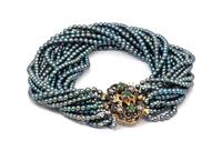 An 18 Karat Yellow Gold, Emerald, Diamond and Black Pearl Bracelet, 27.40 dwts.