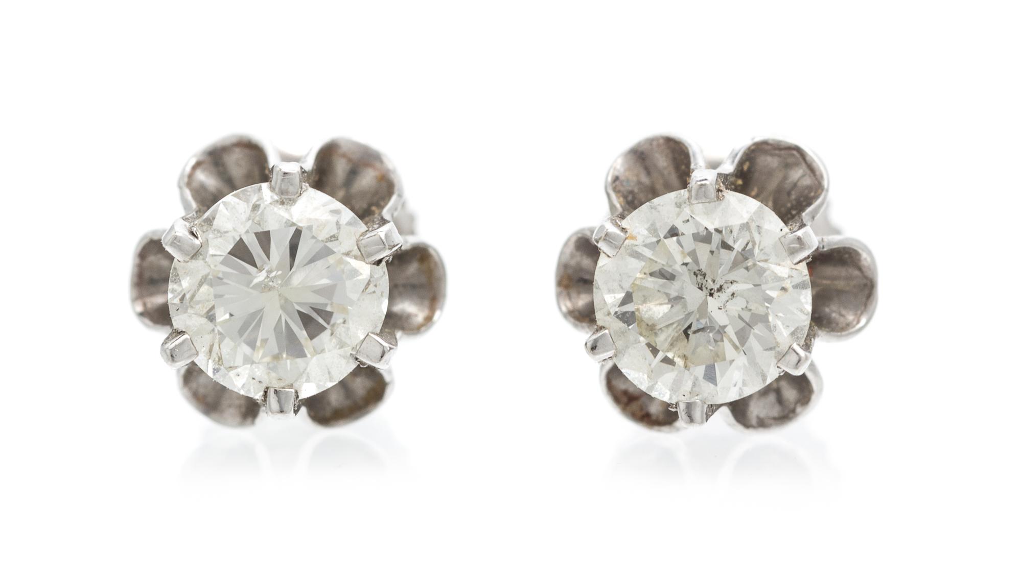 A Pair of White Gold and Diamond Stud Earrings, 1.30 dwts.