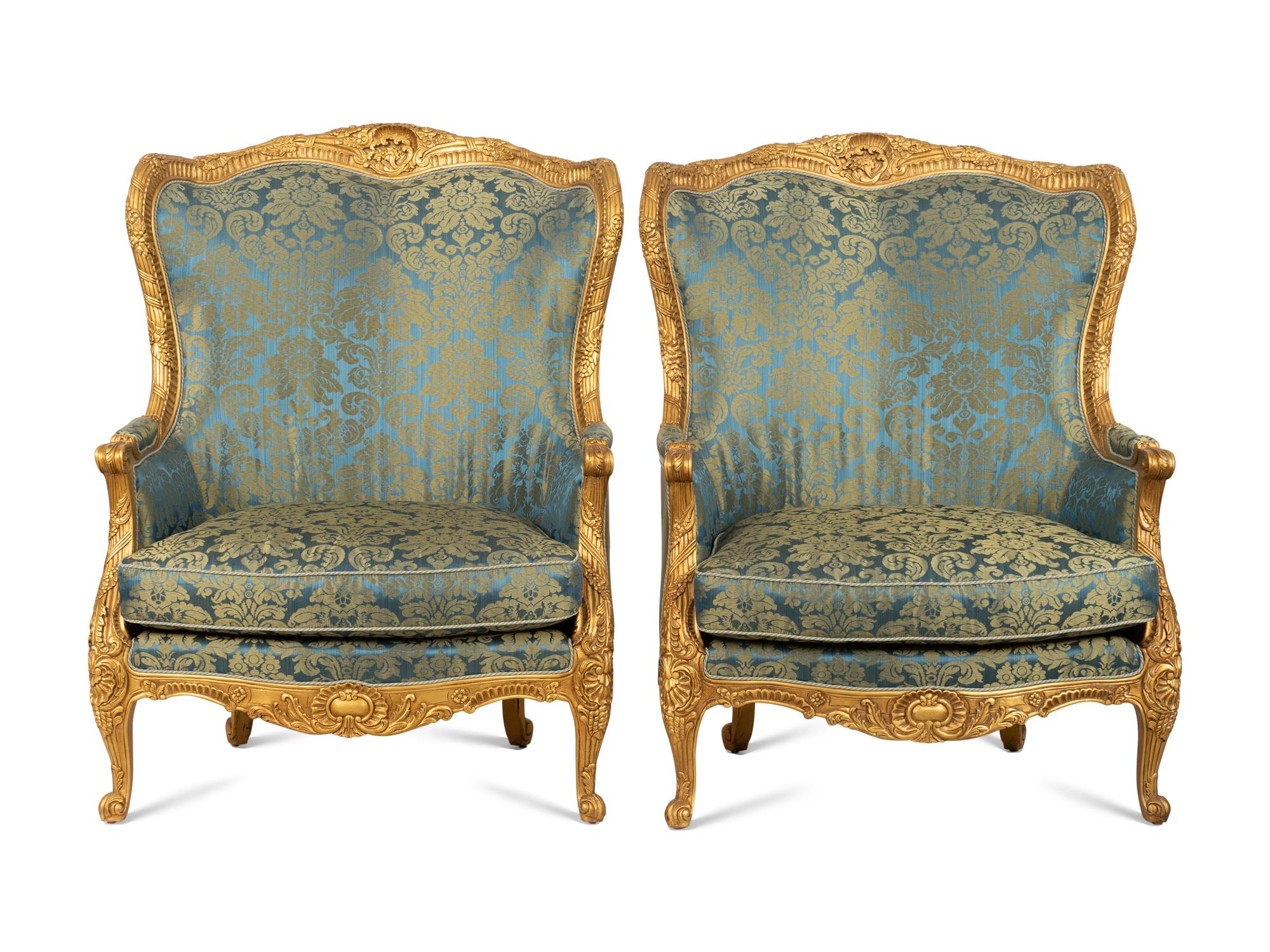 A Pair of Large E.J. Victor Régence Style Giltwood Bergères