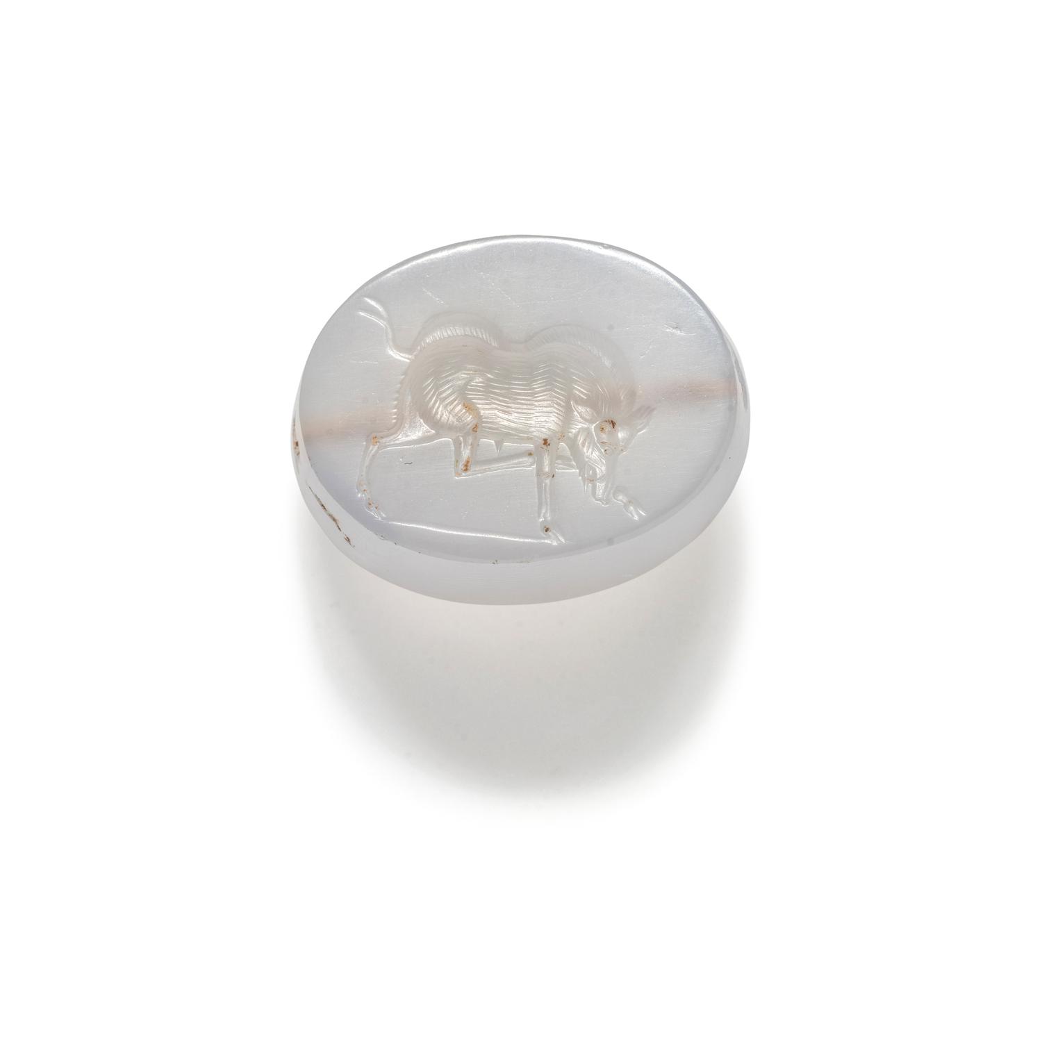A Greco-Persian Chalcedony Scaraboid with a Charging Boar