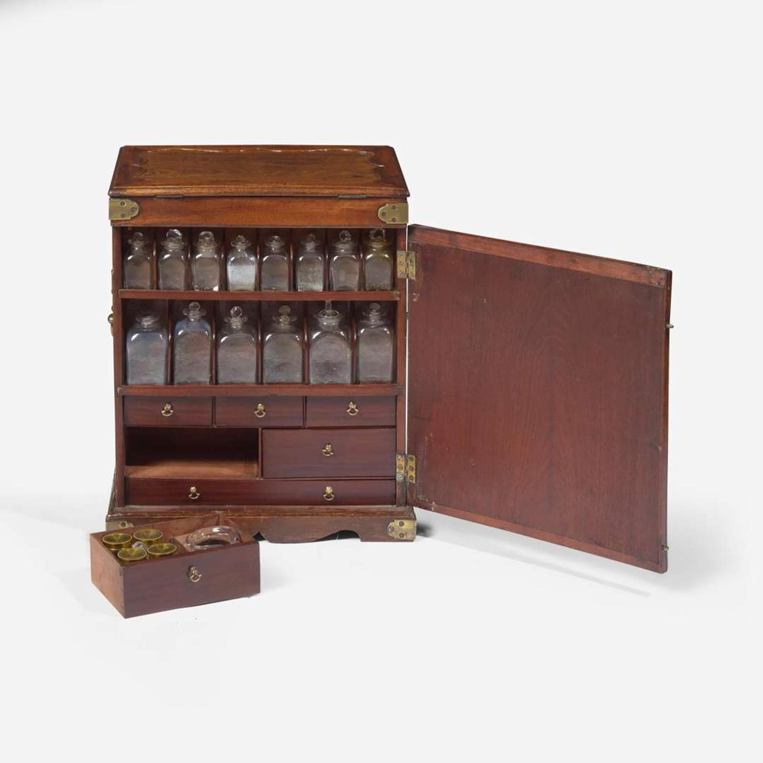 A George II carved mahogany apothecary cabinet circa 1740