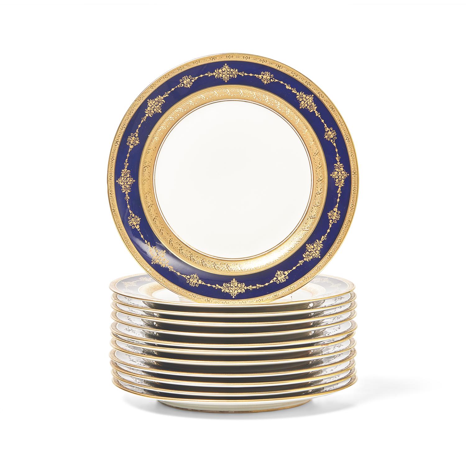A Set of Twelve Limoges Cobalt Ground Parcel Gilt Dinner Plates