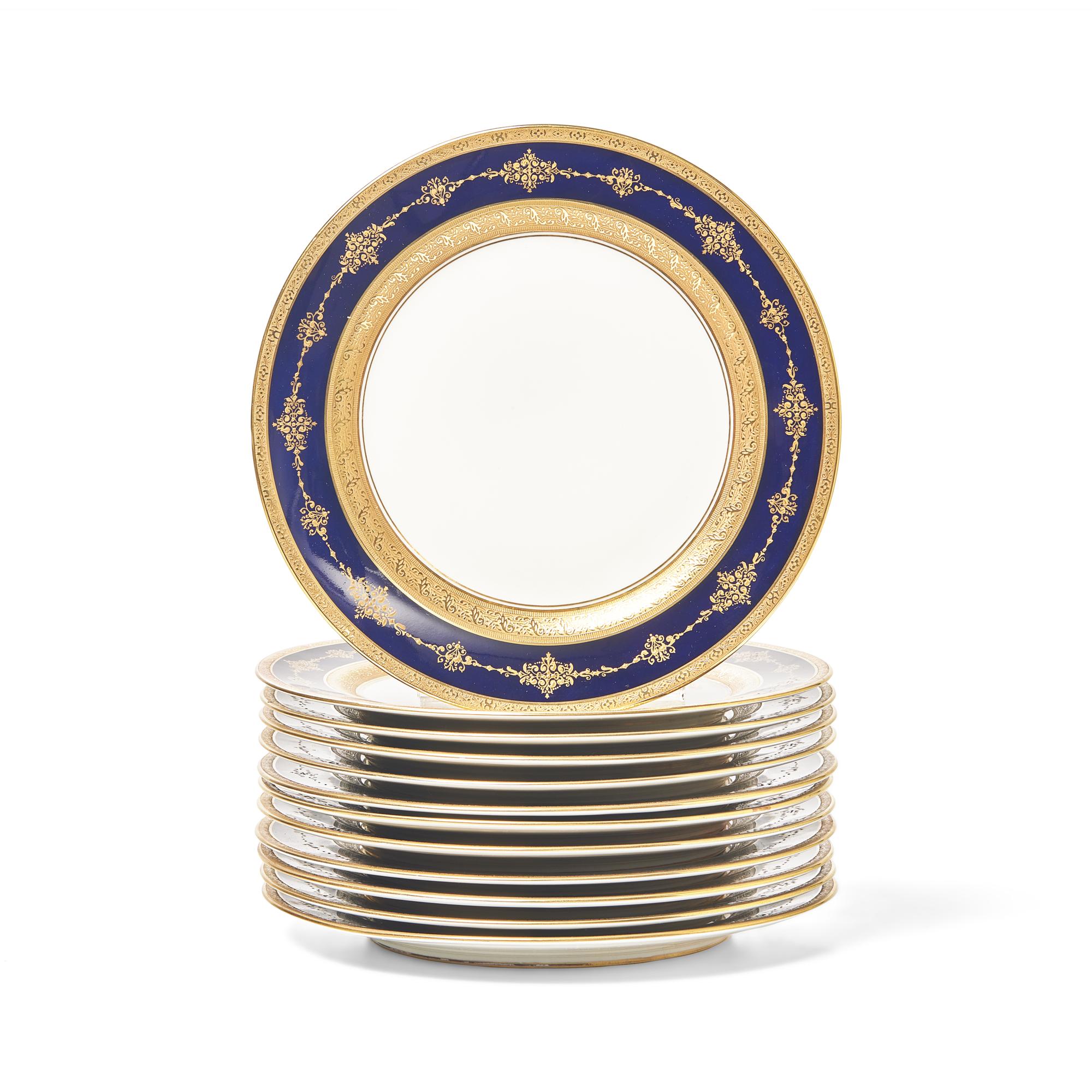 A Set of Twelve Limoges Cobalt Ground Parcel Gilt Dinner Plates