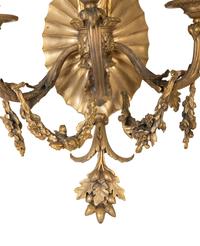 A Pair of Louis XVI Style Gilt Bronze Three-Light Sconces — EARLY 20TH CENTURY