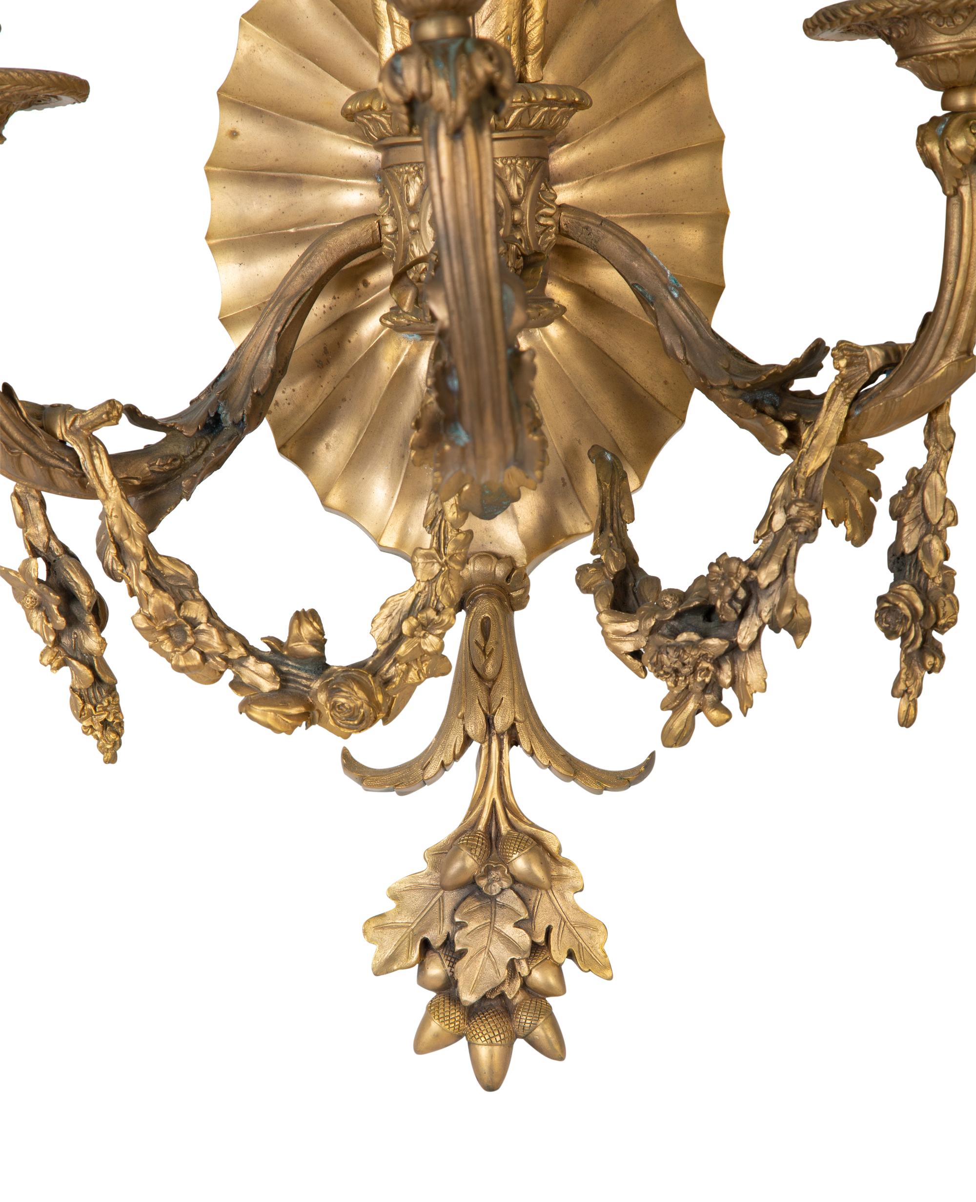 A Pair of Louis XVI Style Gilt Bronze Three-Light Sconces — EARLY 20TH CENTURY