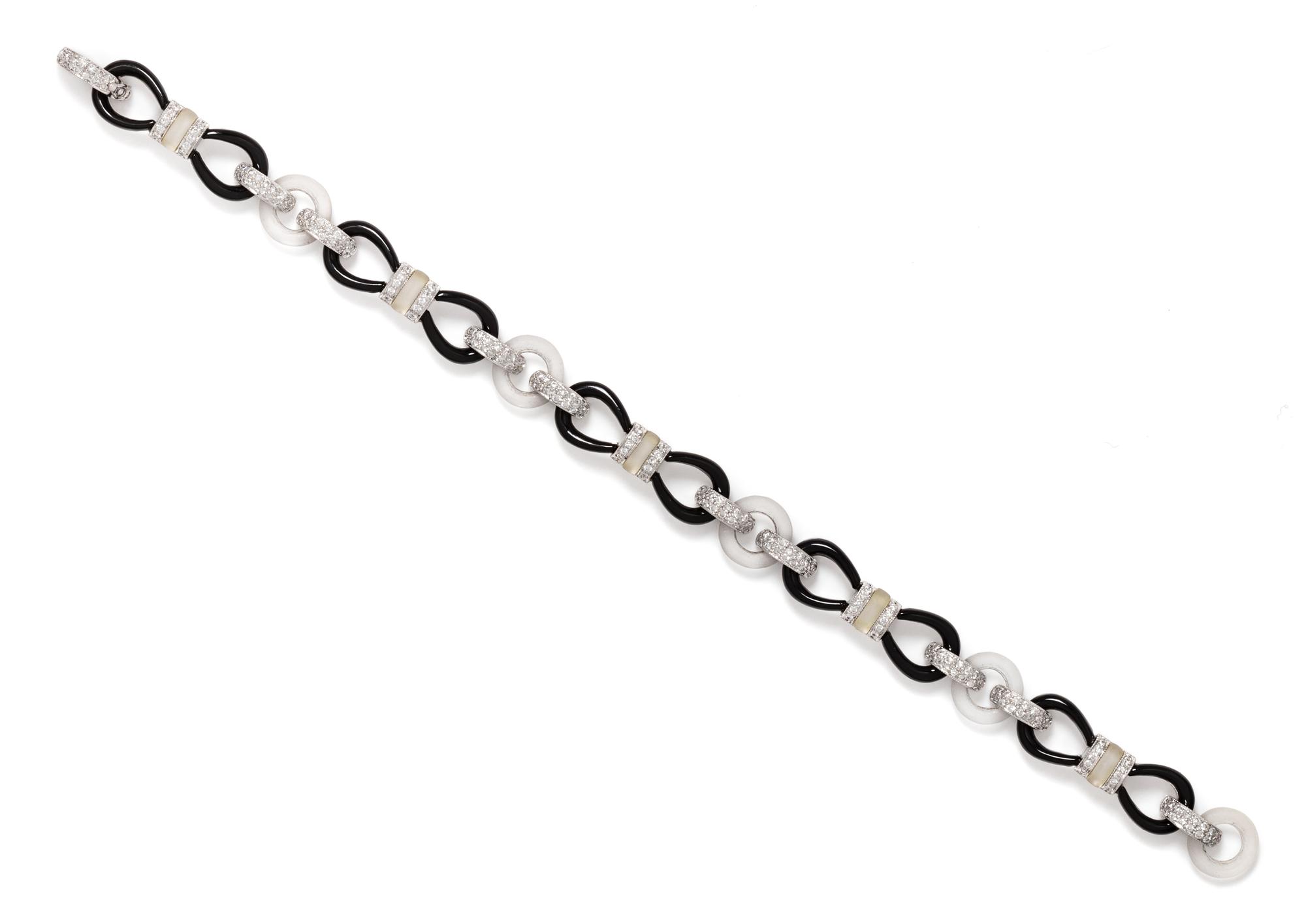 An 18 Karat White Gold, Diamond, Onyx and Rock Crystal Bracelet, 11.00 dwts.