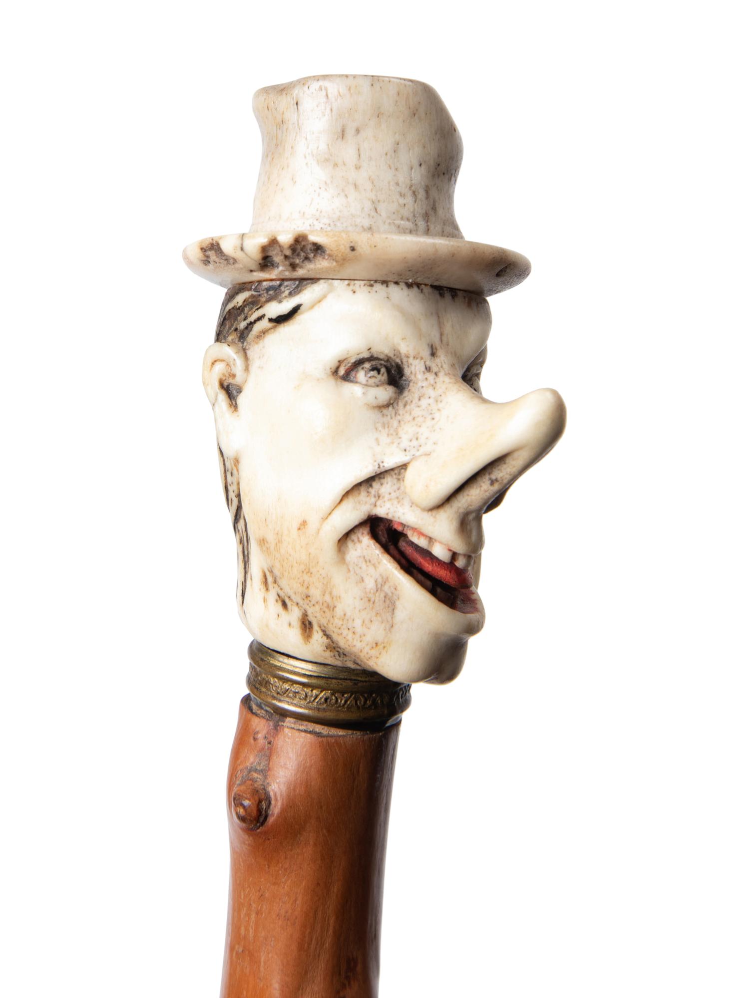 Three Carved Horn or Bone and Brass-Mounted Figural Canes