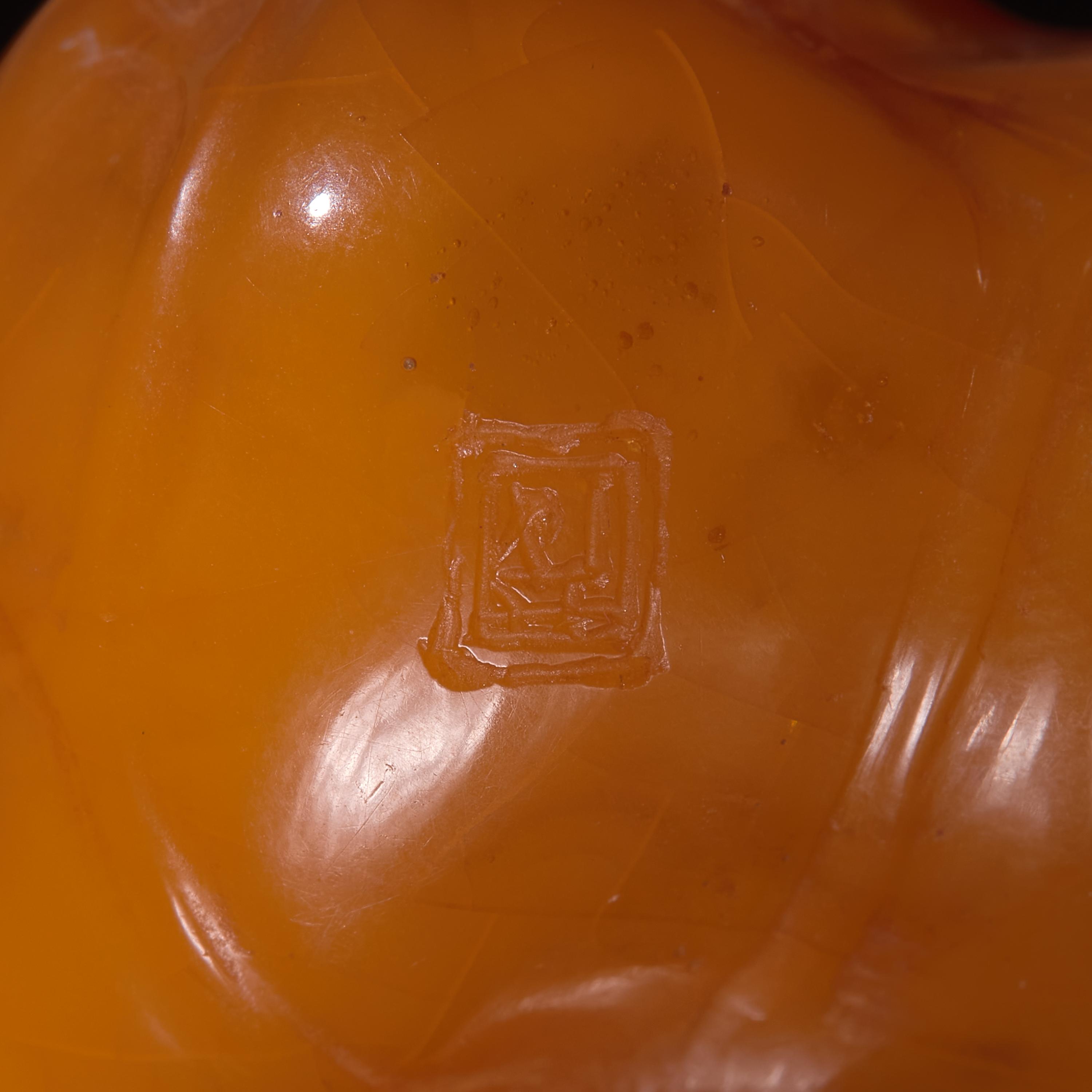 A Chinese 'Beeswax' Amber Lotus Pod and Leaf Pendant — 蜜蠟雕荷葉蓮蓬墜