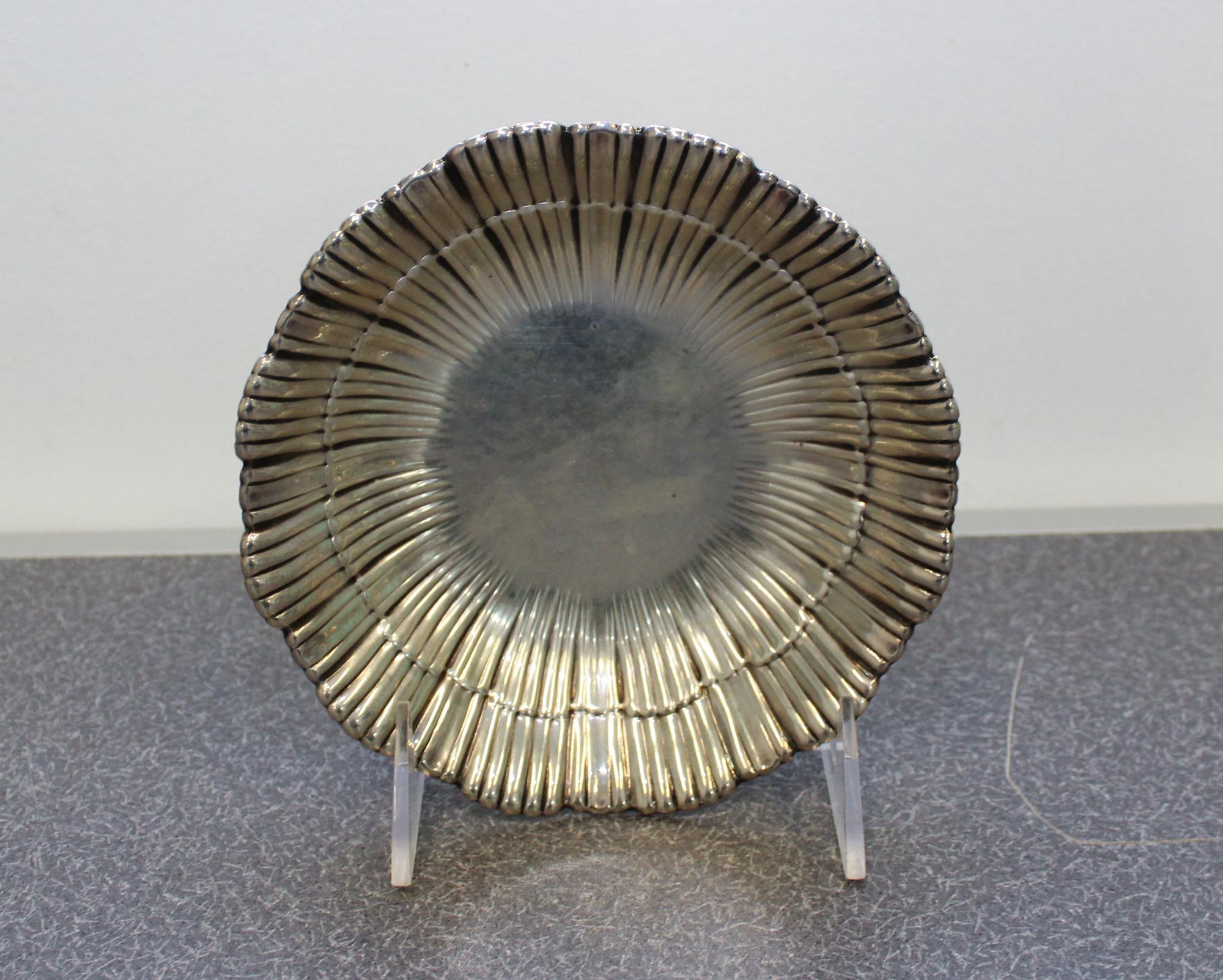 An American Silver Dish, Meriden Britannia Co., Meriden, CT, having a ribbed, scallop form border.