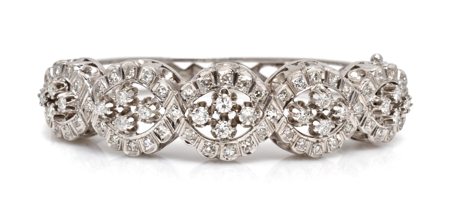 A 14 Karat White Gold and Diamond Bangle Bracelet, 21.10 dwts.