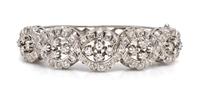A 14 Karat White Gold and Diamond Bangle Bracelet, 21.10 dwts.