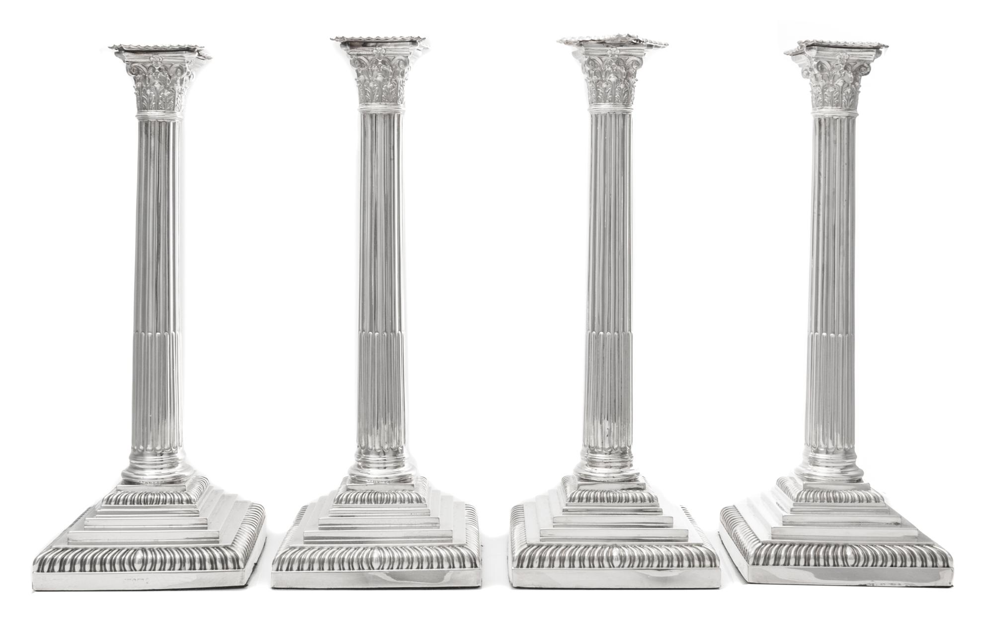 A Set of Four English Silver-Plate Candlesticks, Maker's mark obscured, each of Corinthian columnar form, raised on a stepped base with
