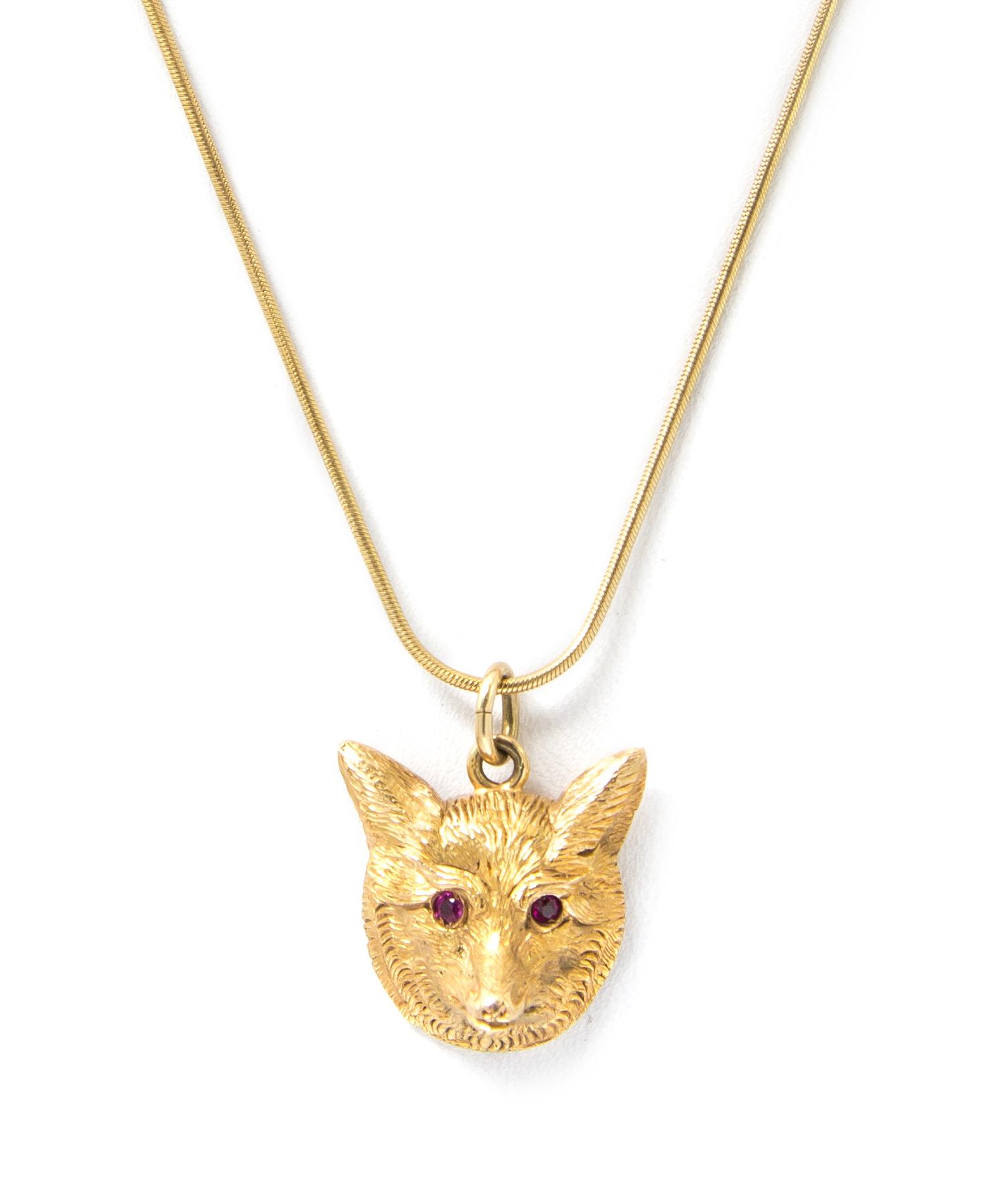 A Yellow Gold and Ruby Fox Pendant, J. E. Caldwell, 8.30 dwts.
