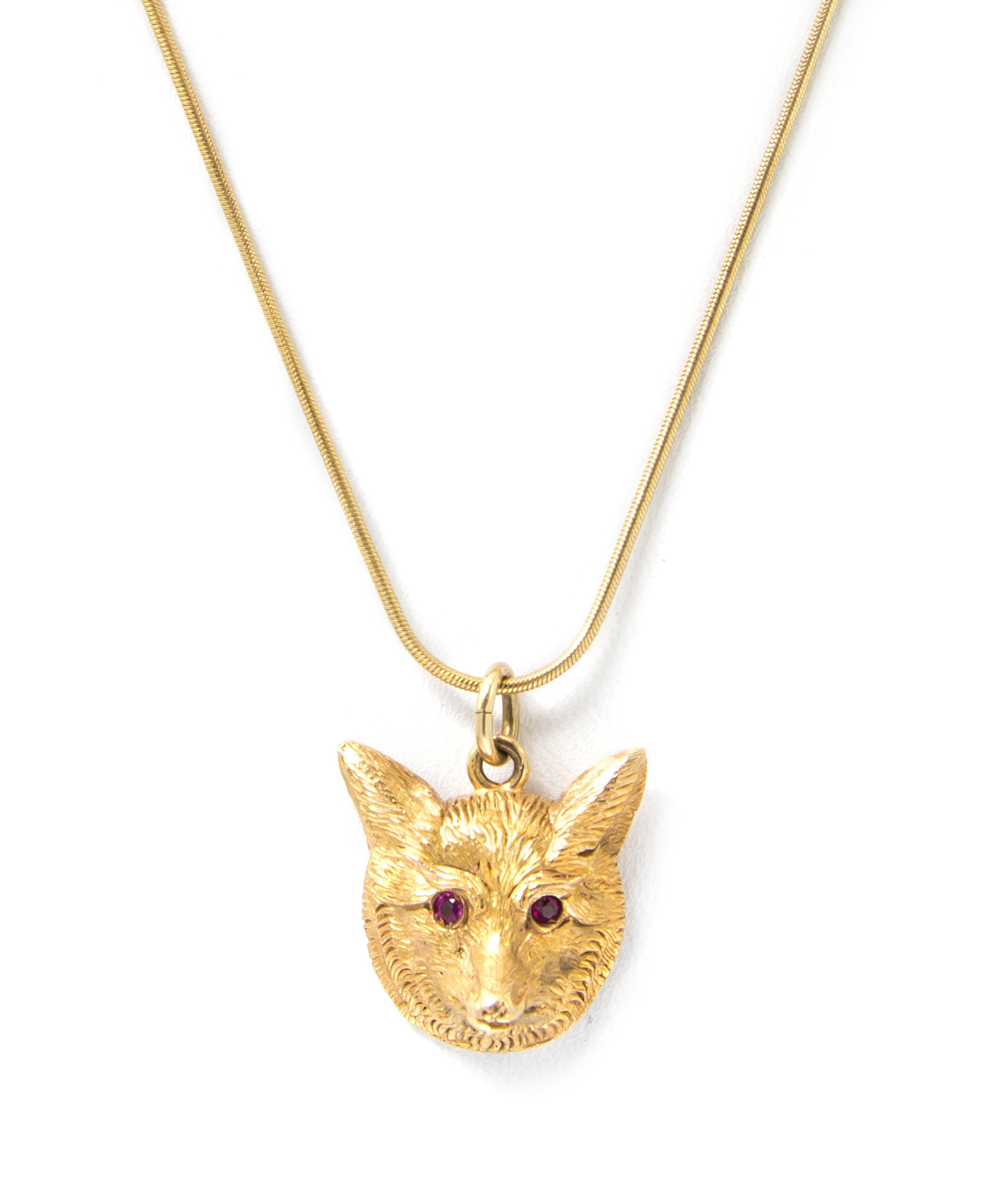 A Yellow Gold and Ruby Fox Pendant, J. E. Caldwell, 8.30 dwts.