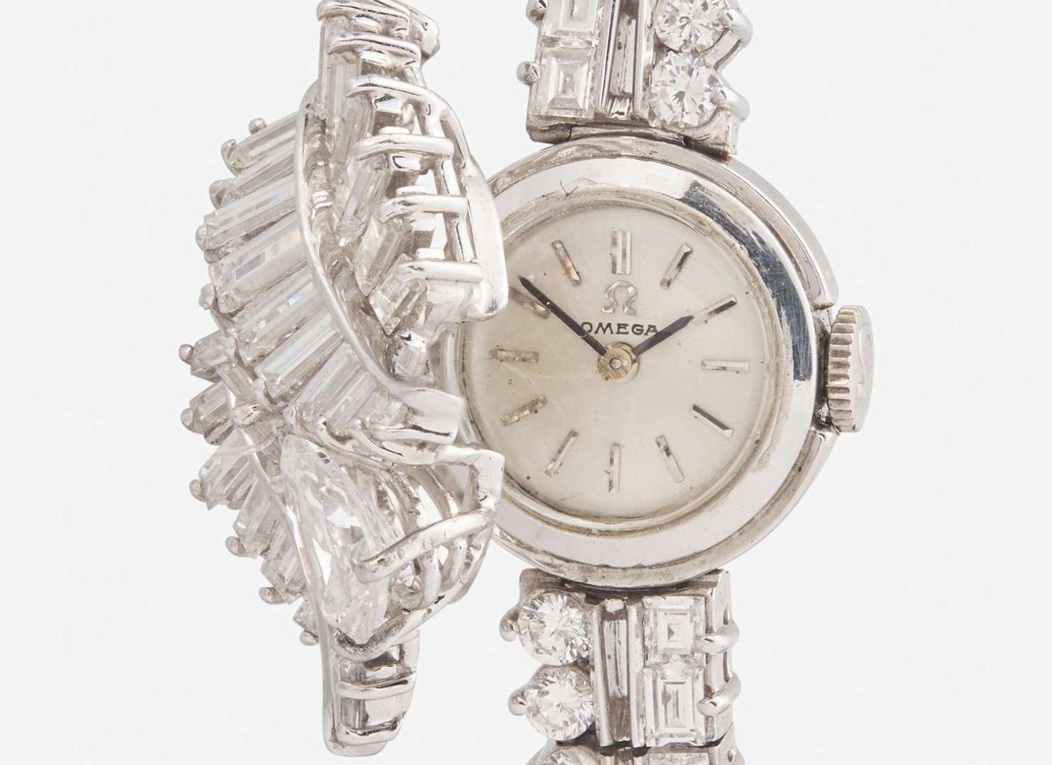 A Ladies Hidden Dial Platinum and Diamond Omega Watch